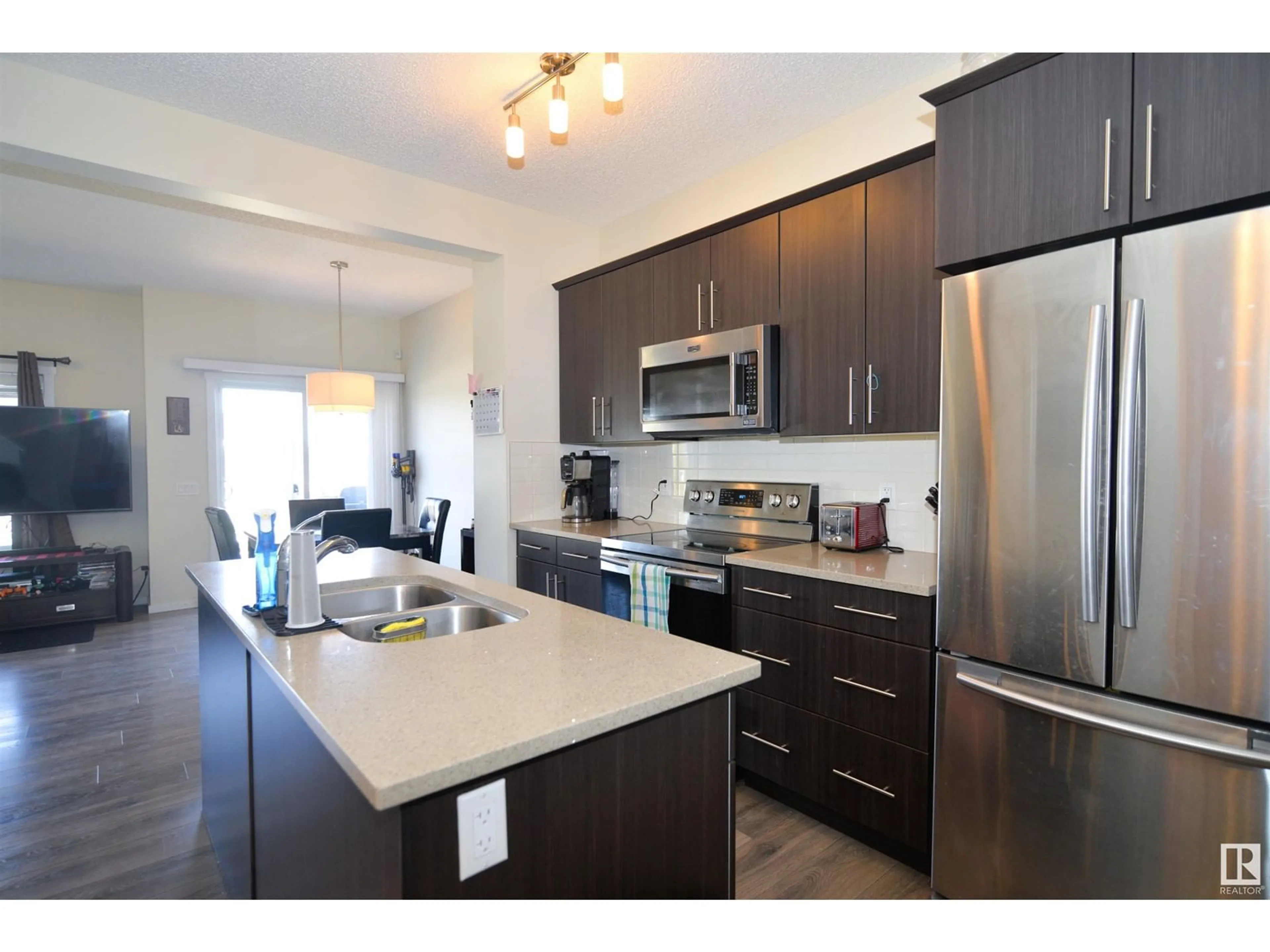 Open concept kitchen, wood/laminate floor for 47 AVEBURY CT, Sherwood Park Alberta T8H0Z3