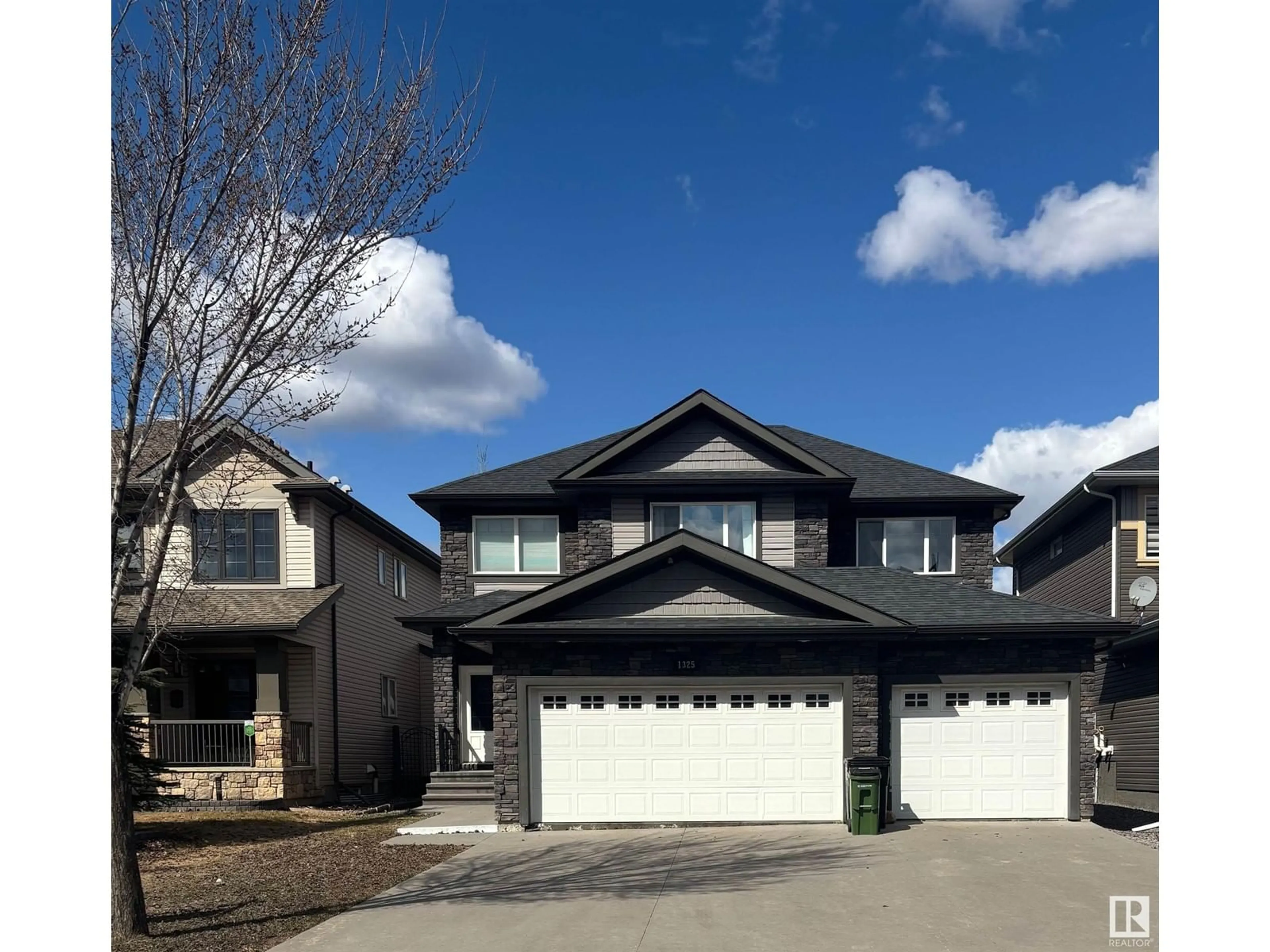 Home with vinyl exterior material, street for 1325 ADAMSON DR, Edmonton Alberta T6W2N8