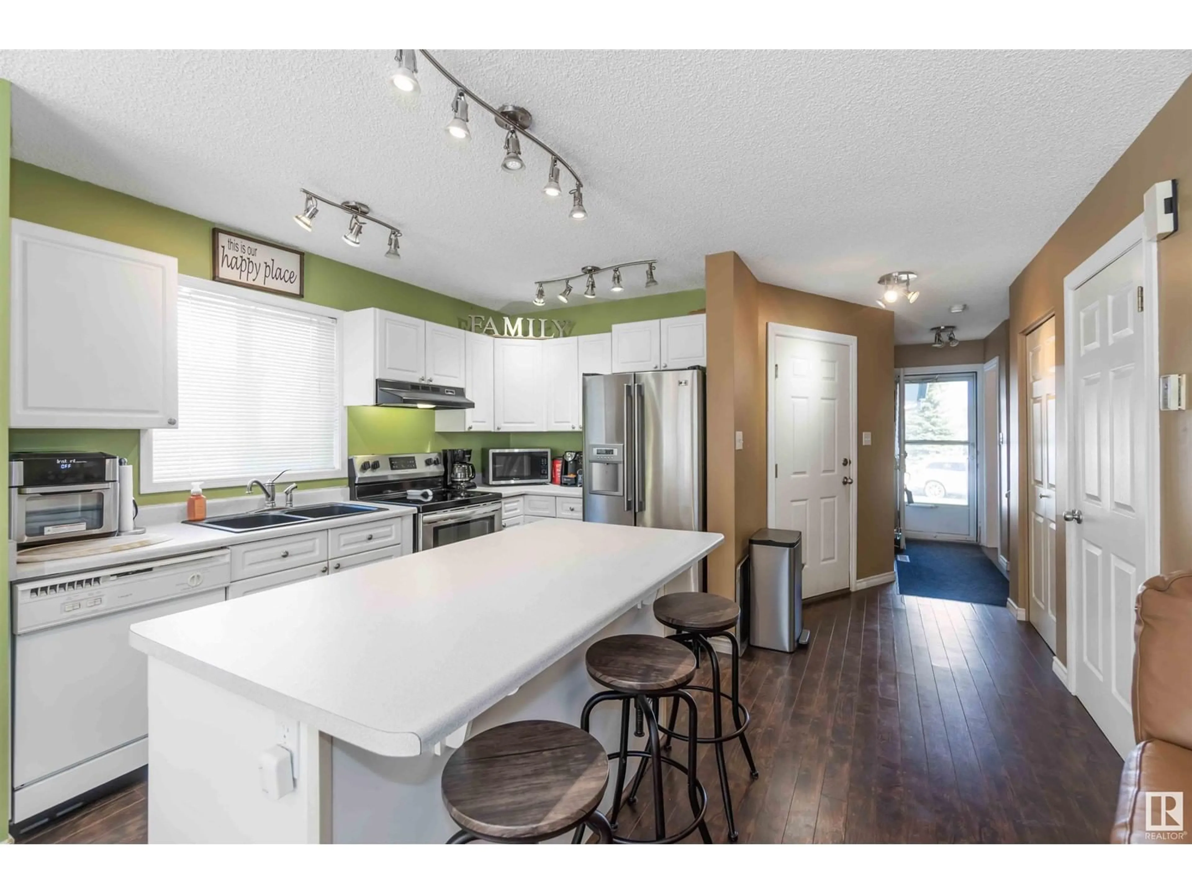 Open concept kitchen, wood/laminate floor for NW - 13434 33 ST, Edmonton Alberta T5A5C1
