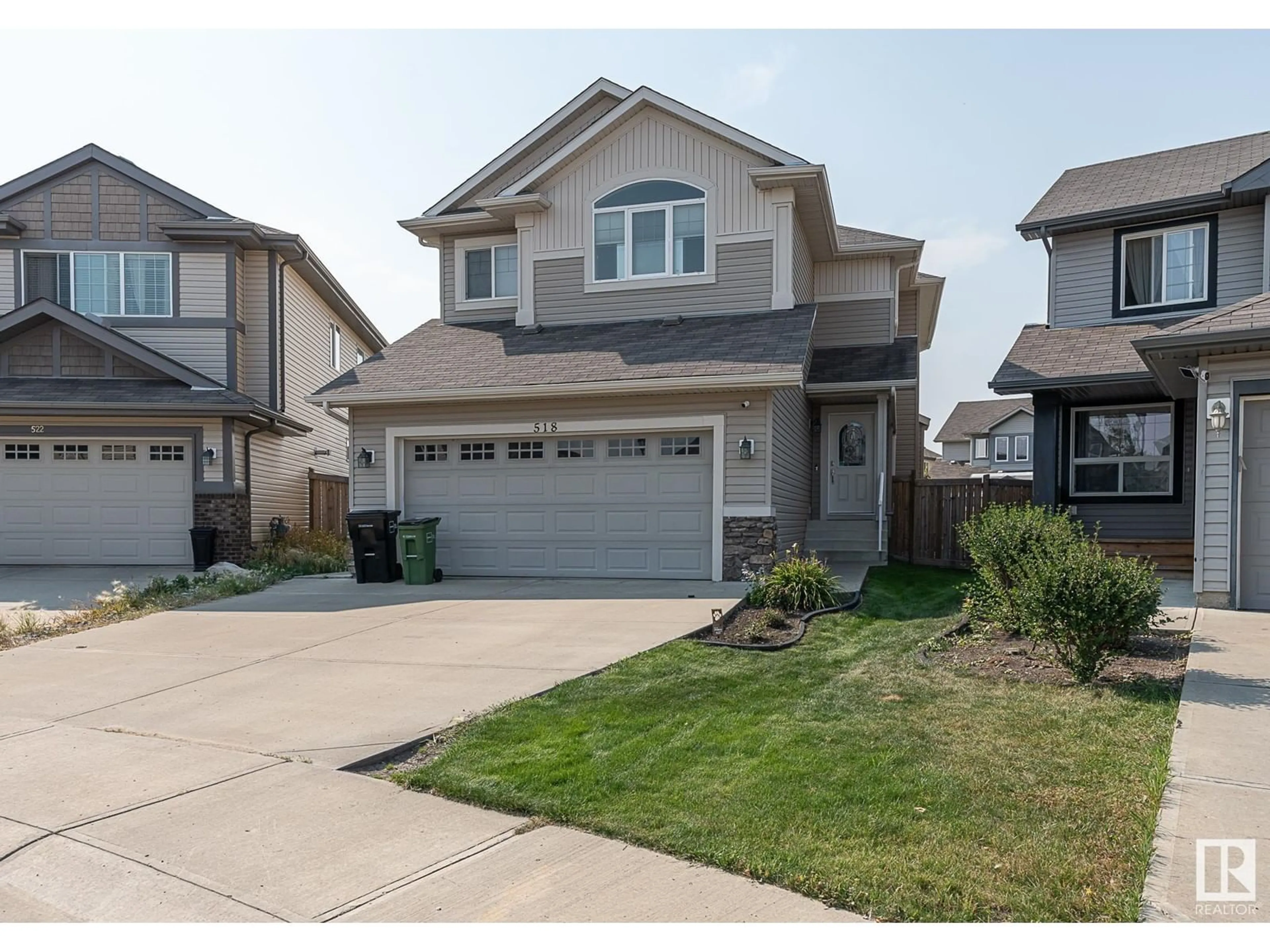 Home with vinyl exterior material, street for 518 173A ST, Edmonton Alberta T6W2A5