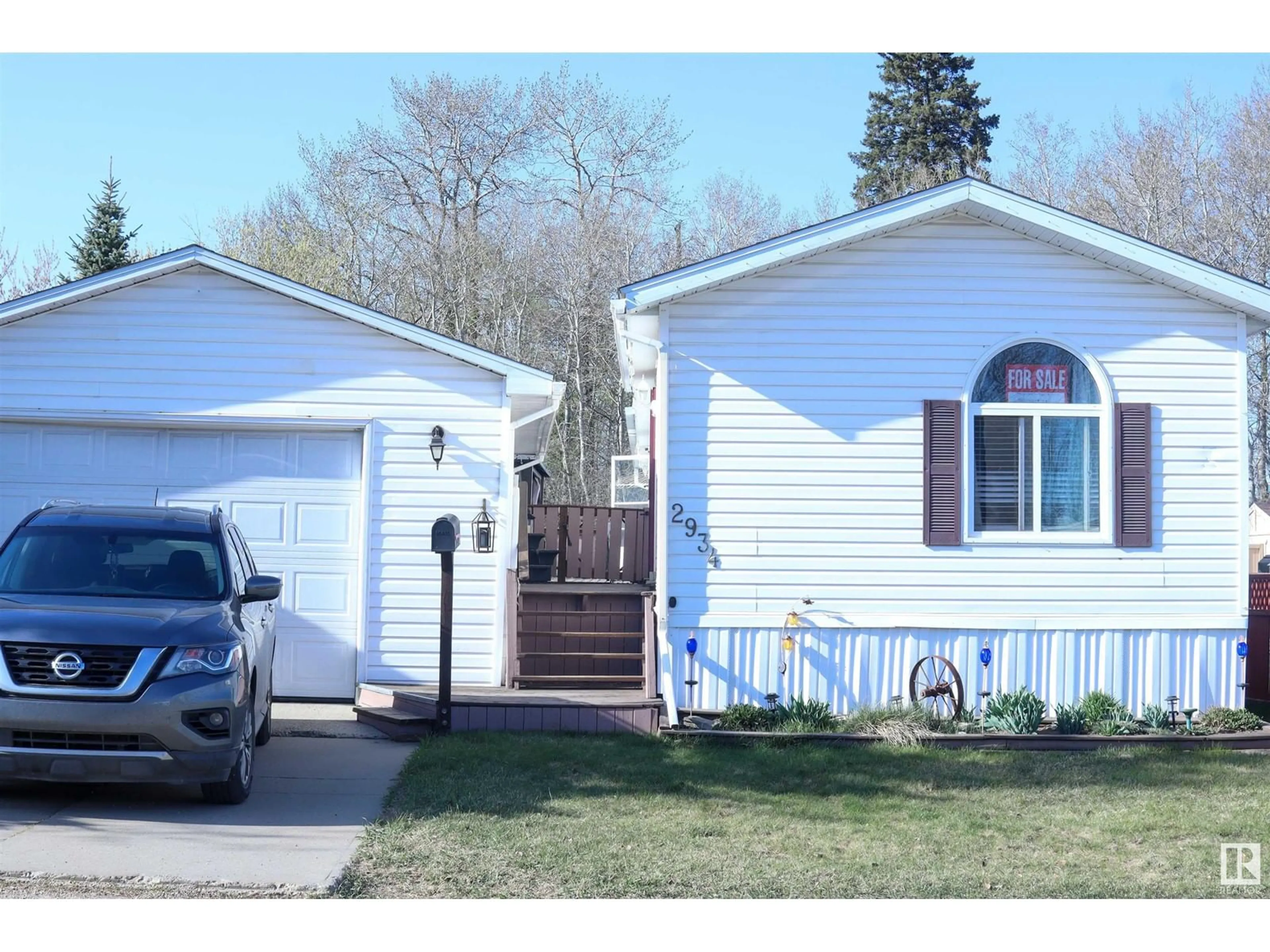 Home with vinyl exterior material, street for 2934 LAKEWOOD RD, Edmonton Alberta T5S1T7