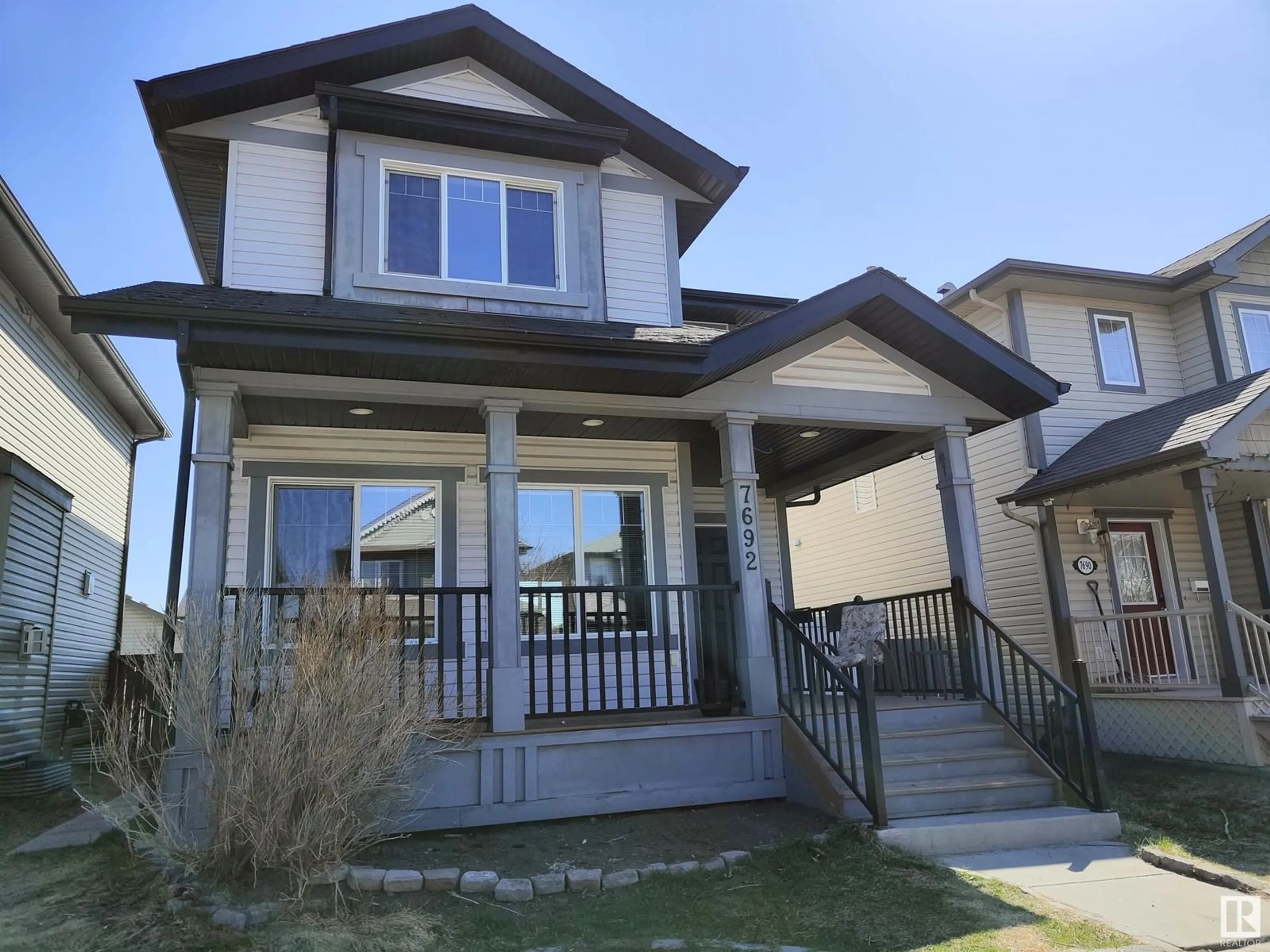 Home with vinyl exterior material, street for 7692 SCHMID CR, Edmonton Alberta T6R0K7