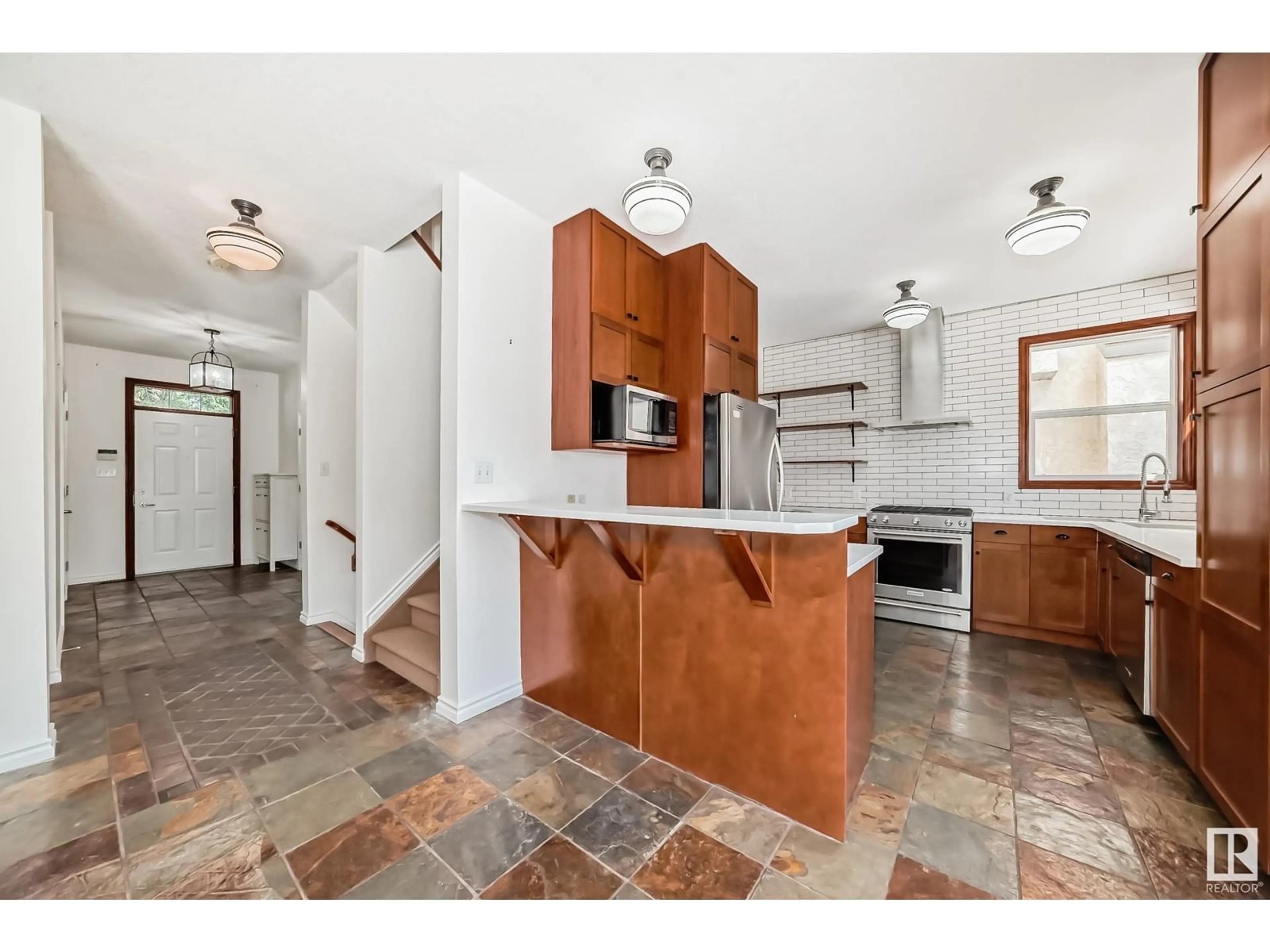 Open concept kitchen, ceramic/tile floor for 11809 71A AV, Edmonton Alberta T6G2W5