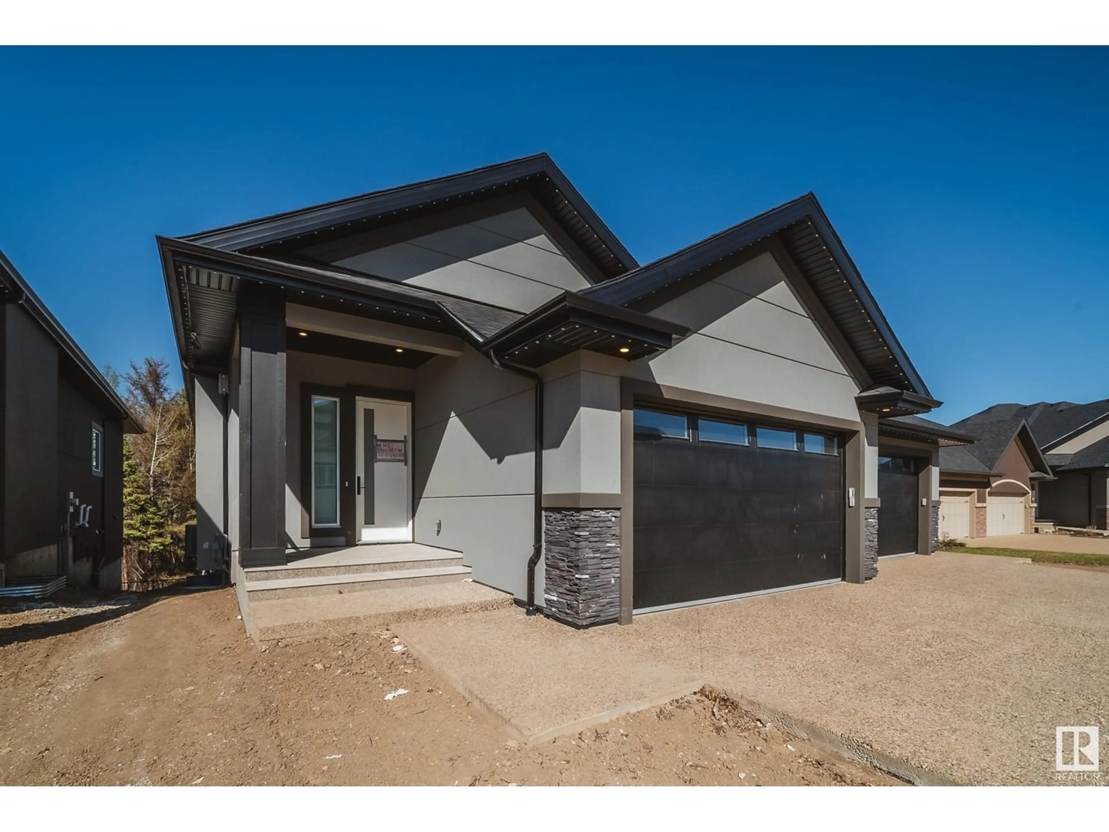 Home with vinyl exterior material, street for #25 - 20425 93 AV, Edmonton Alberta T5T7C7