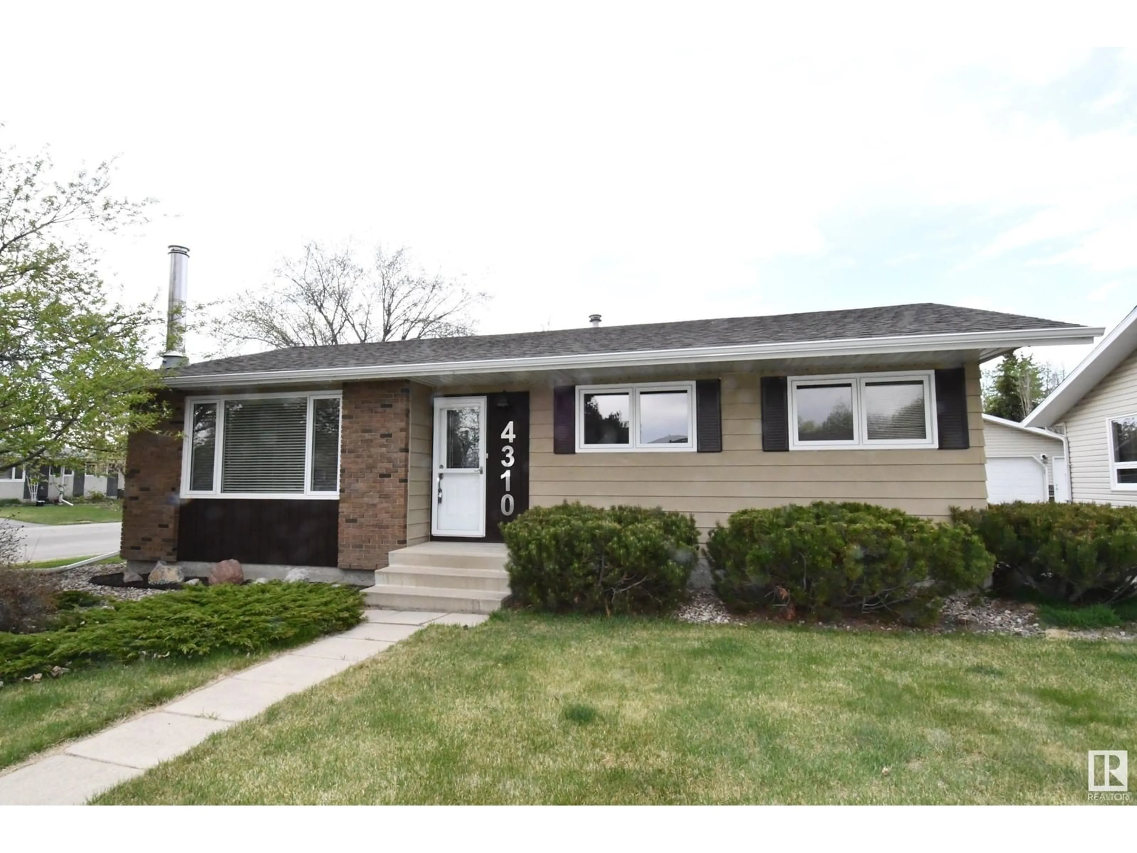 Home with vinyl exterior material, street for 4310 36 AV, Leduc Alberta T9E6A2