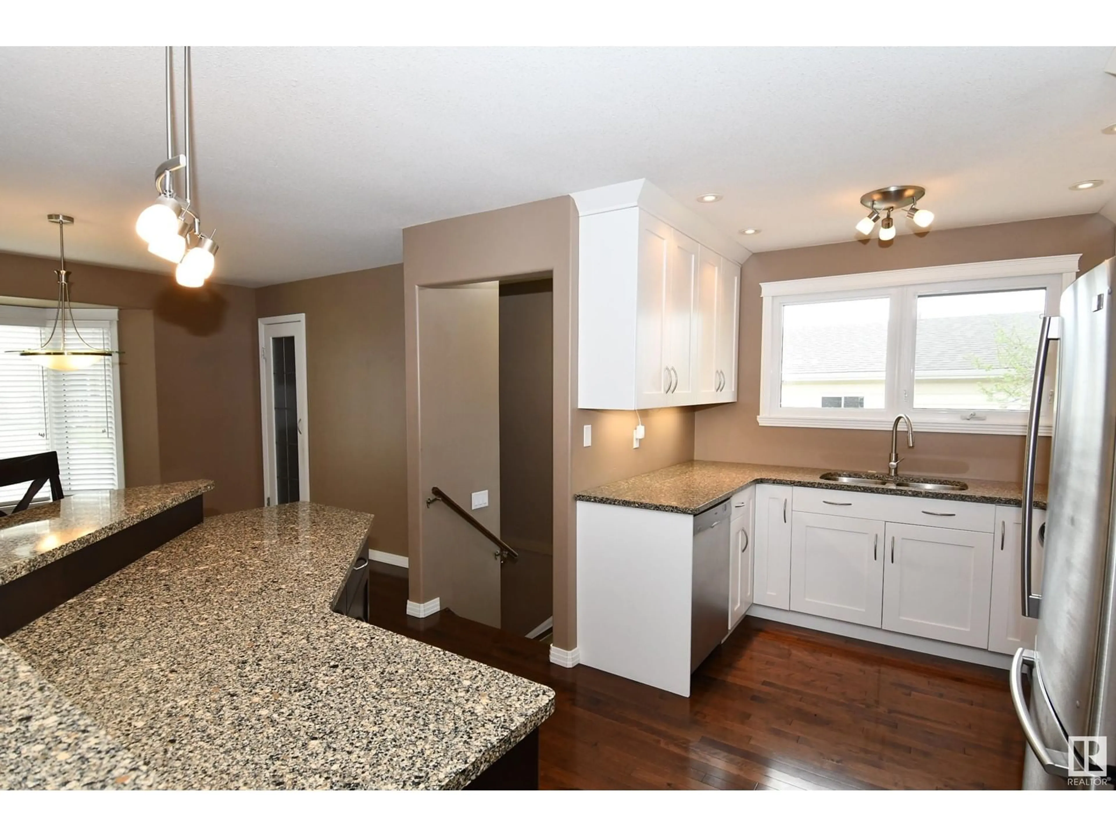 Open concept kitchen, wood/laminate floor for 4310 36 AV, Leduc Alberta T9E6A2