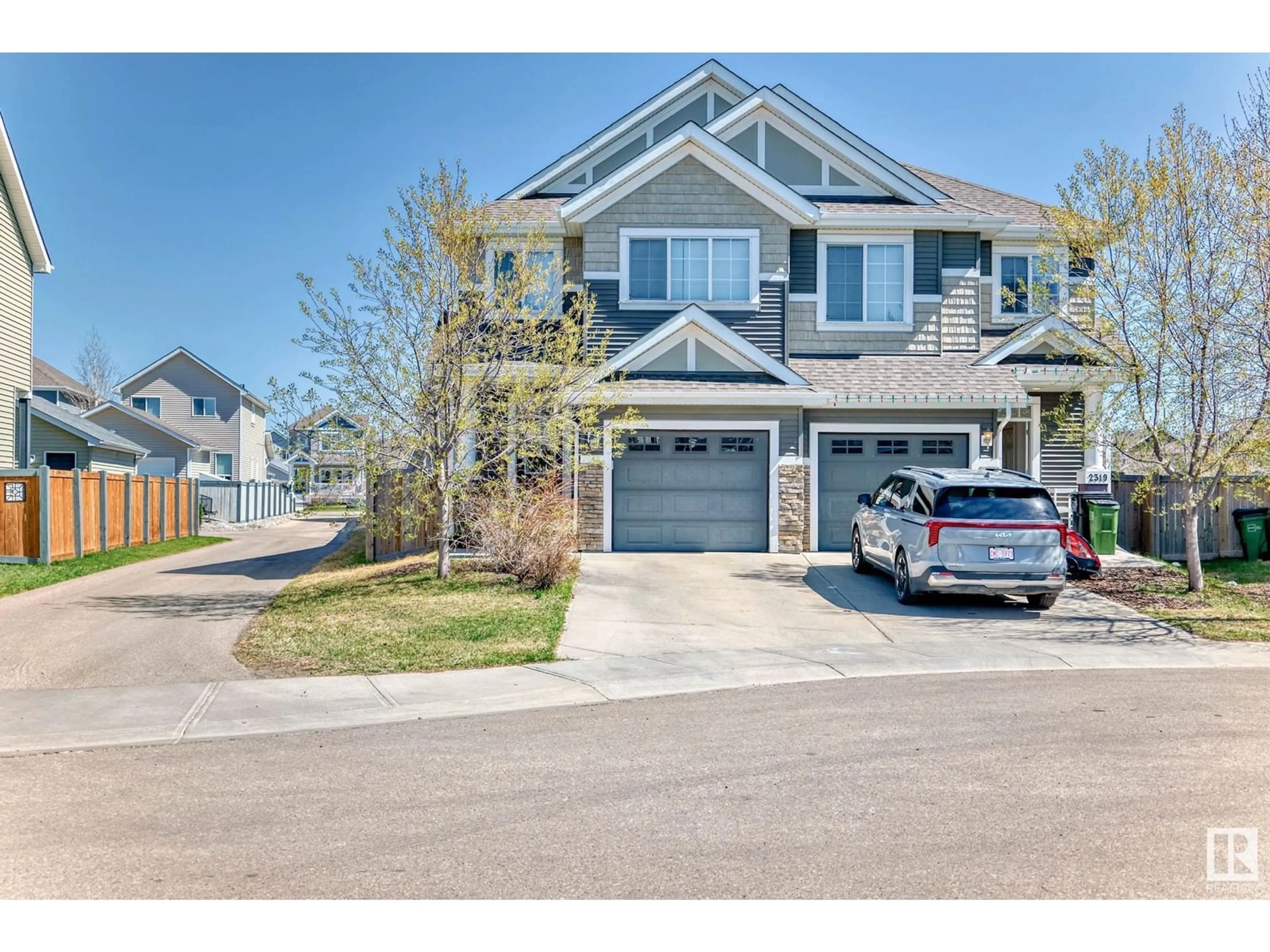 Home with vinyl exterior material, street for 2317 76 ST, Edmonton Alberta T6X1S6