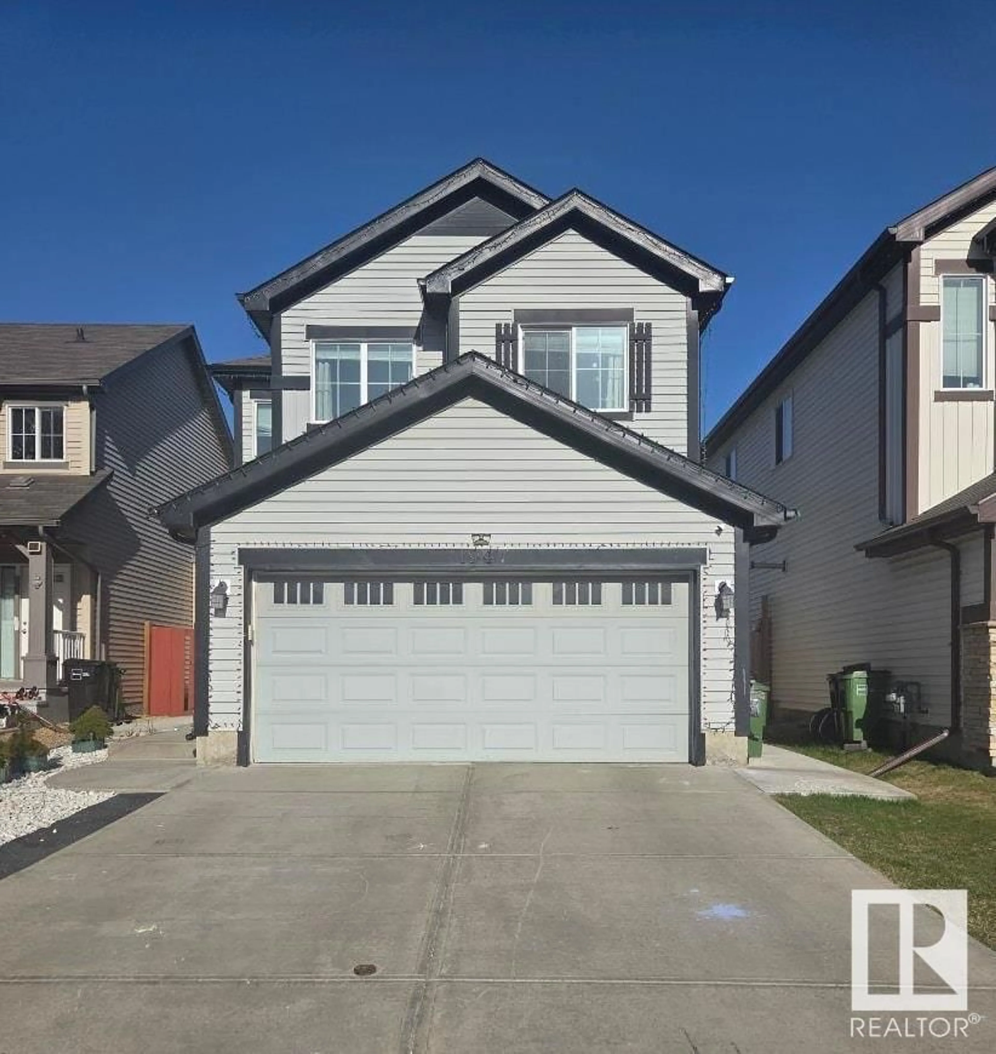 Home with vinyl exterior material, street for SW - 1947 51 ST, Edmonton Alberta T6X1A4