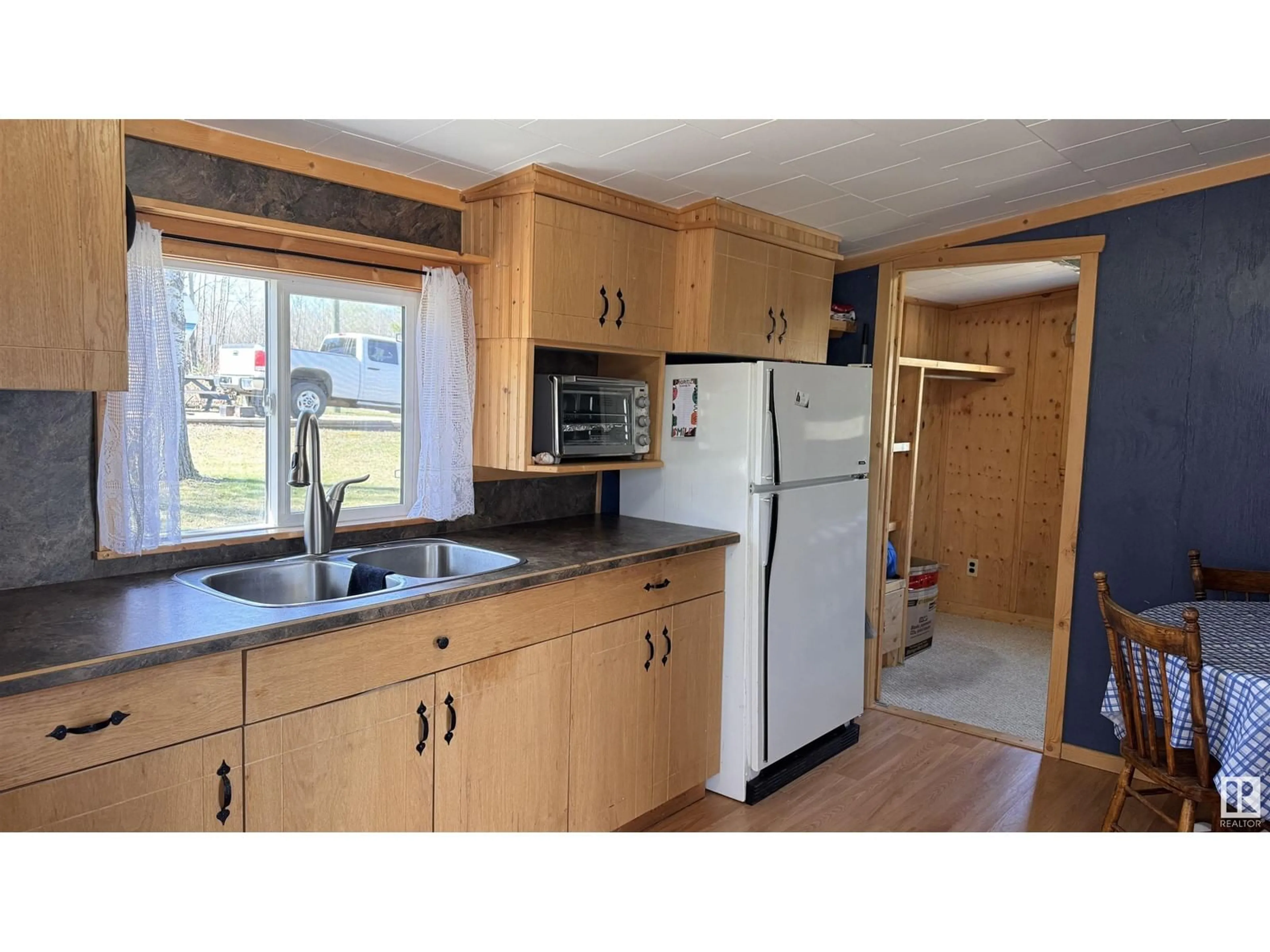 Standard kitchen, wood/laminate floor for 310 - 11121 TWP RD, Rural St. Paul County Alberta T0A0C0