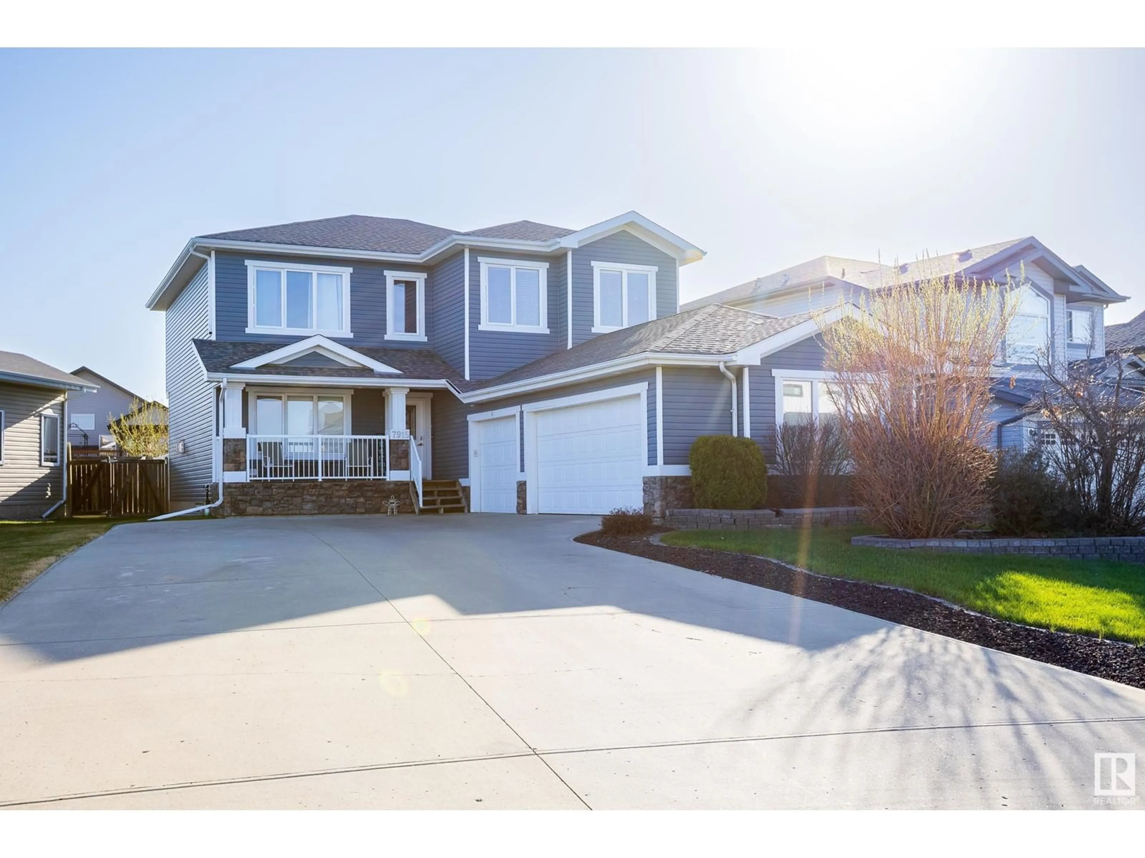 Home with vinyl exterior material, street for 7915 97 ST, Morinville Alberta T8R1W3