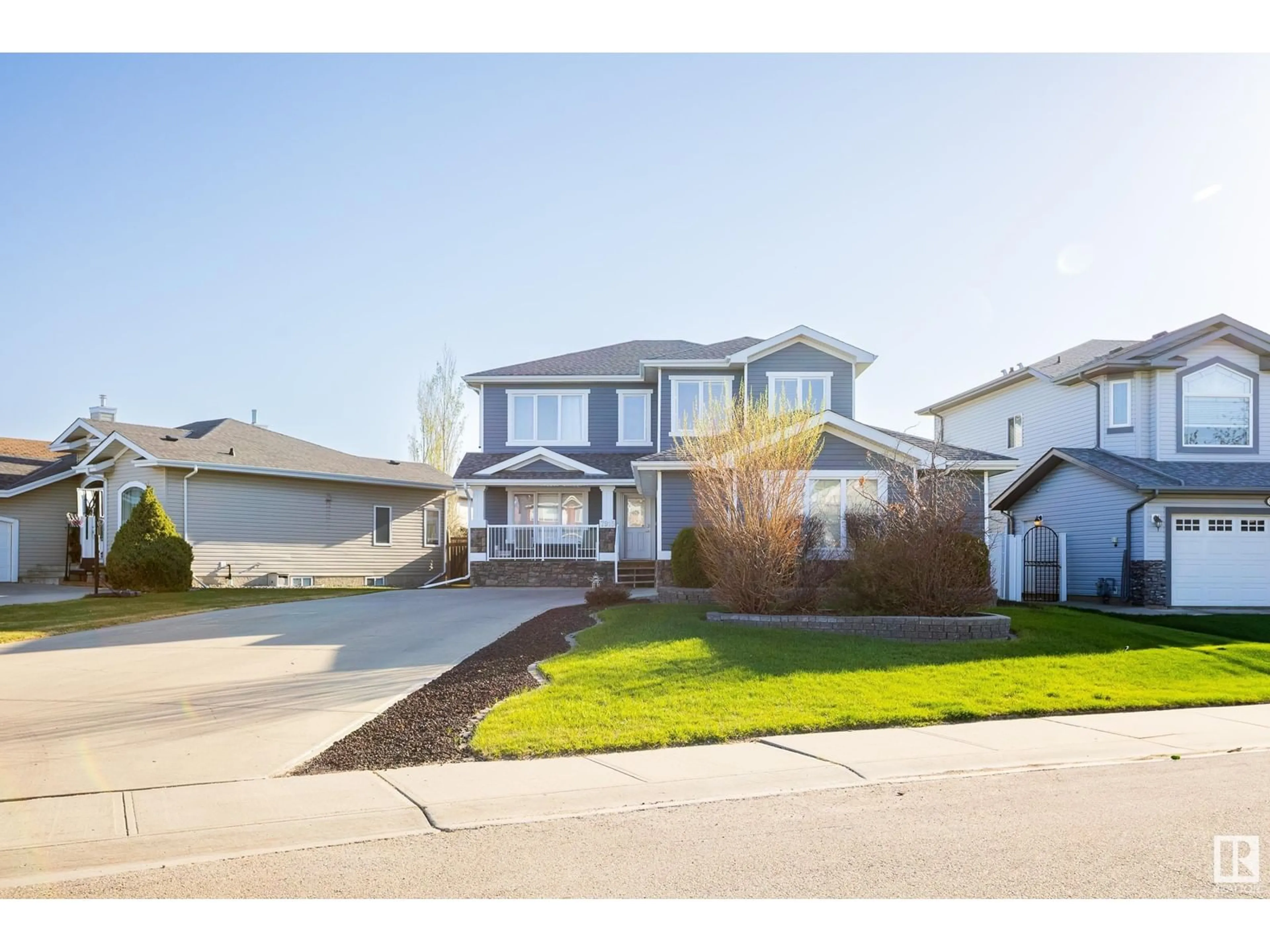 Home with vinyl exterior material, street for 7915 97 ST, Morinville Alberta T8R1W3