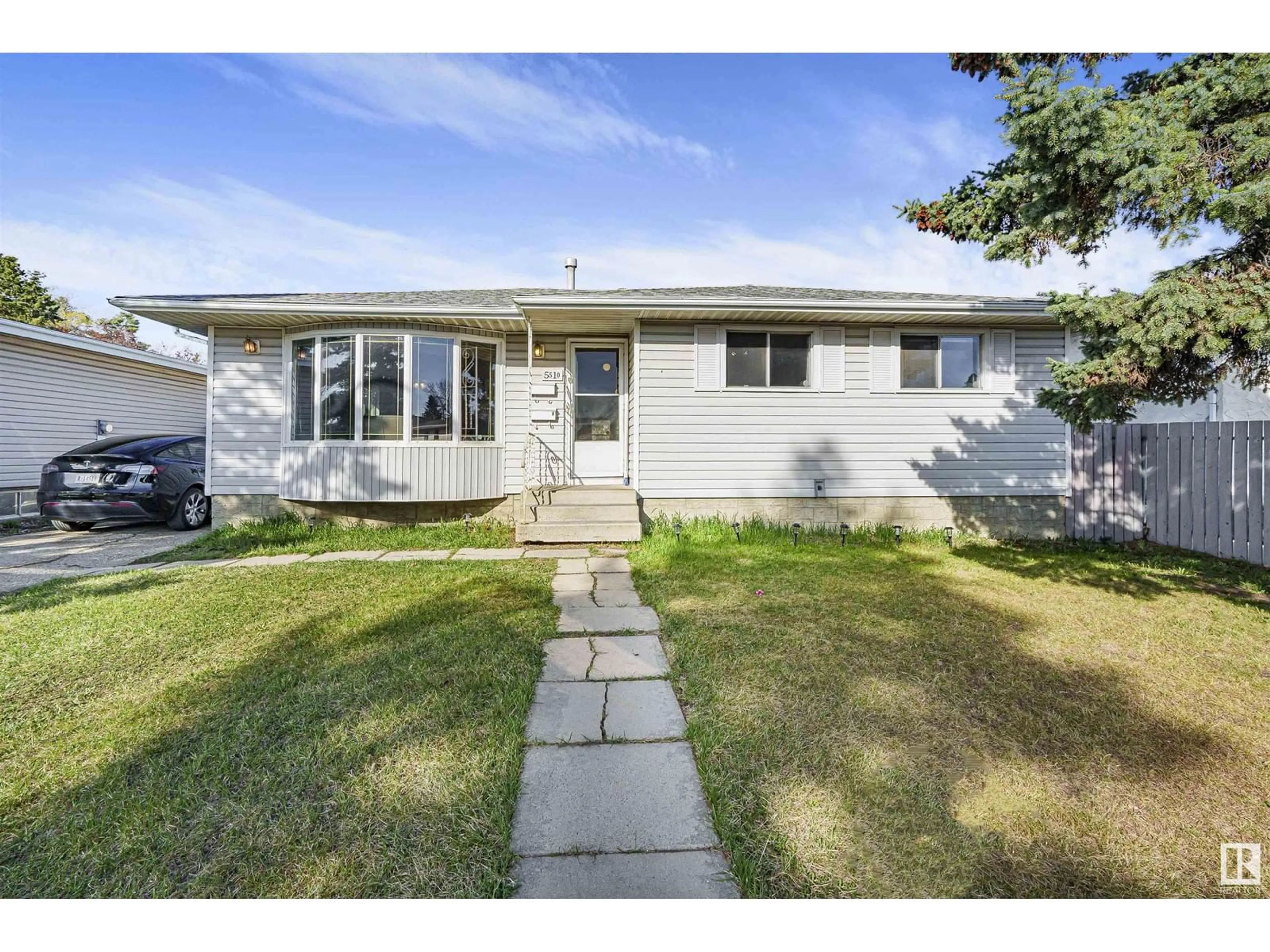 Home with vinyl exterior material, street for NW - 5510 145A AV, Edmonton Alberta T5A2S1
