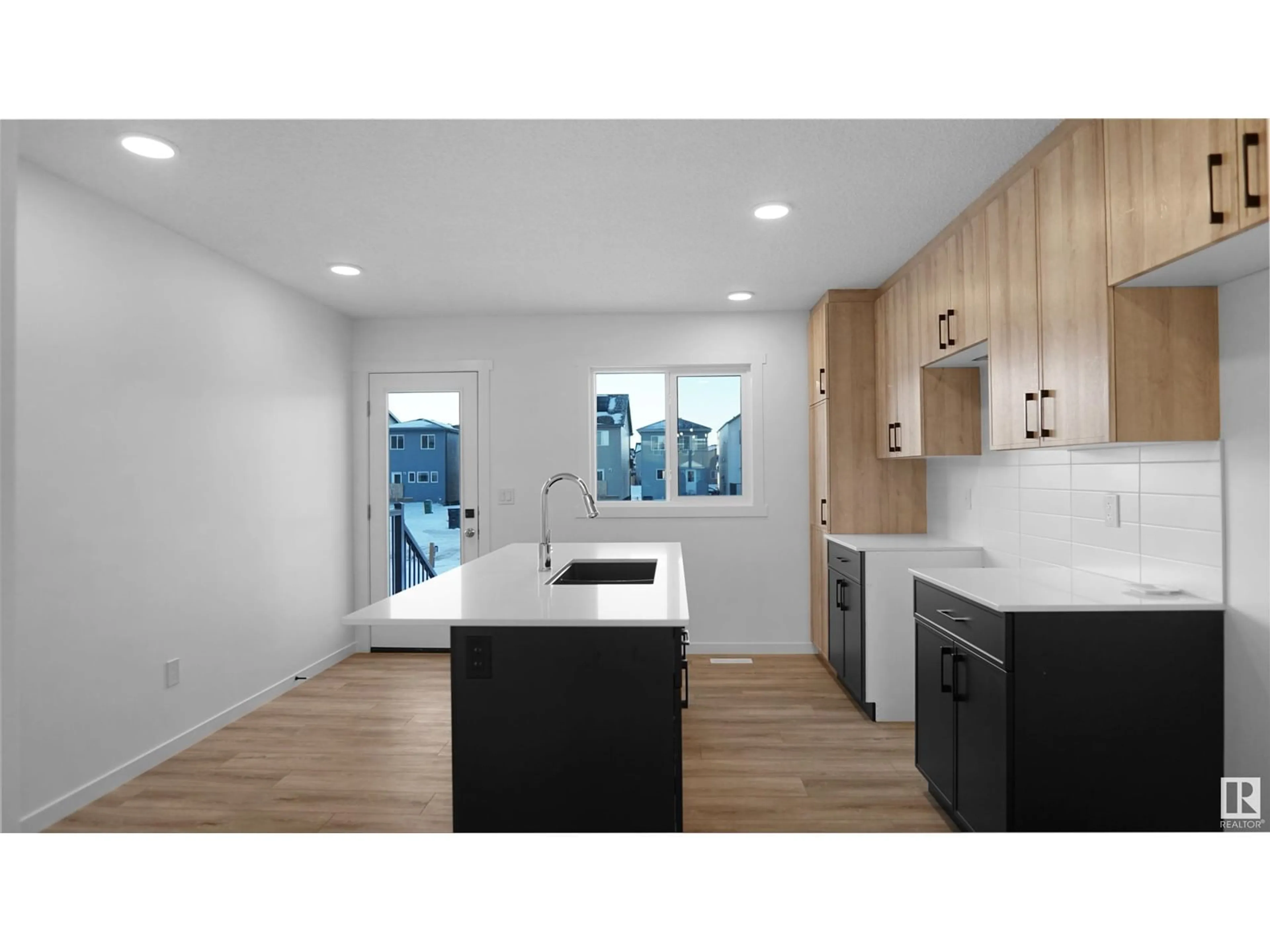 Open concept kitchen, wood/laminate floor for 126 - 1009 CY BECKER RD, Edmonton Alberta T5Y4B7