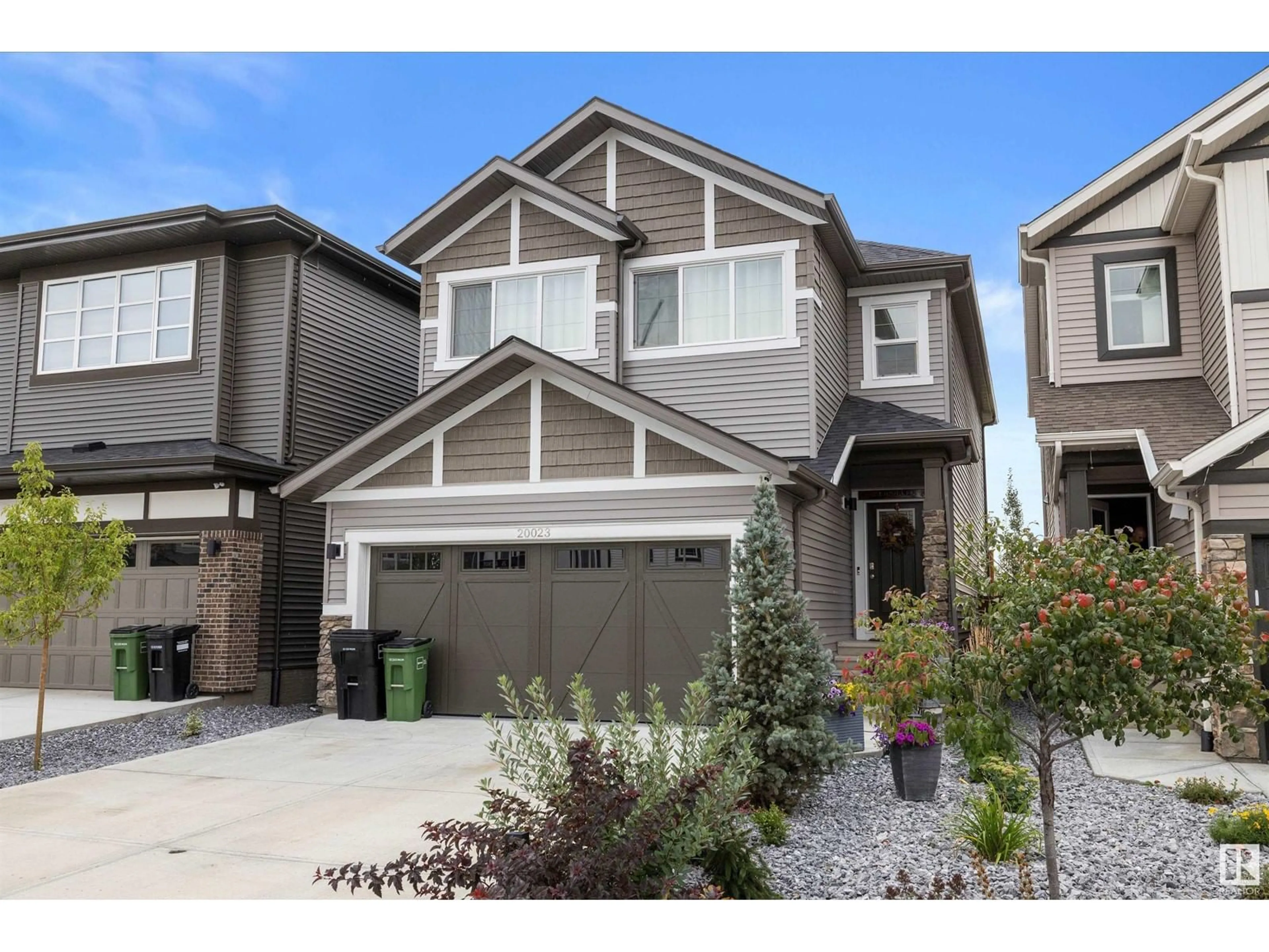 Home with vinyl exterior material, street for NW - 20023 26 AV, Edmonton Alberta T6M1K3