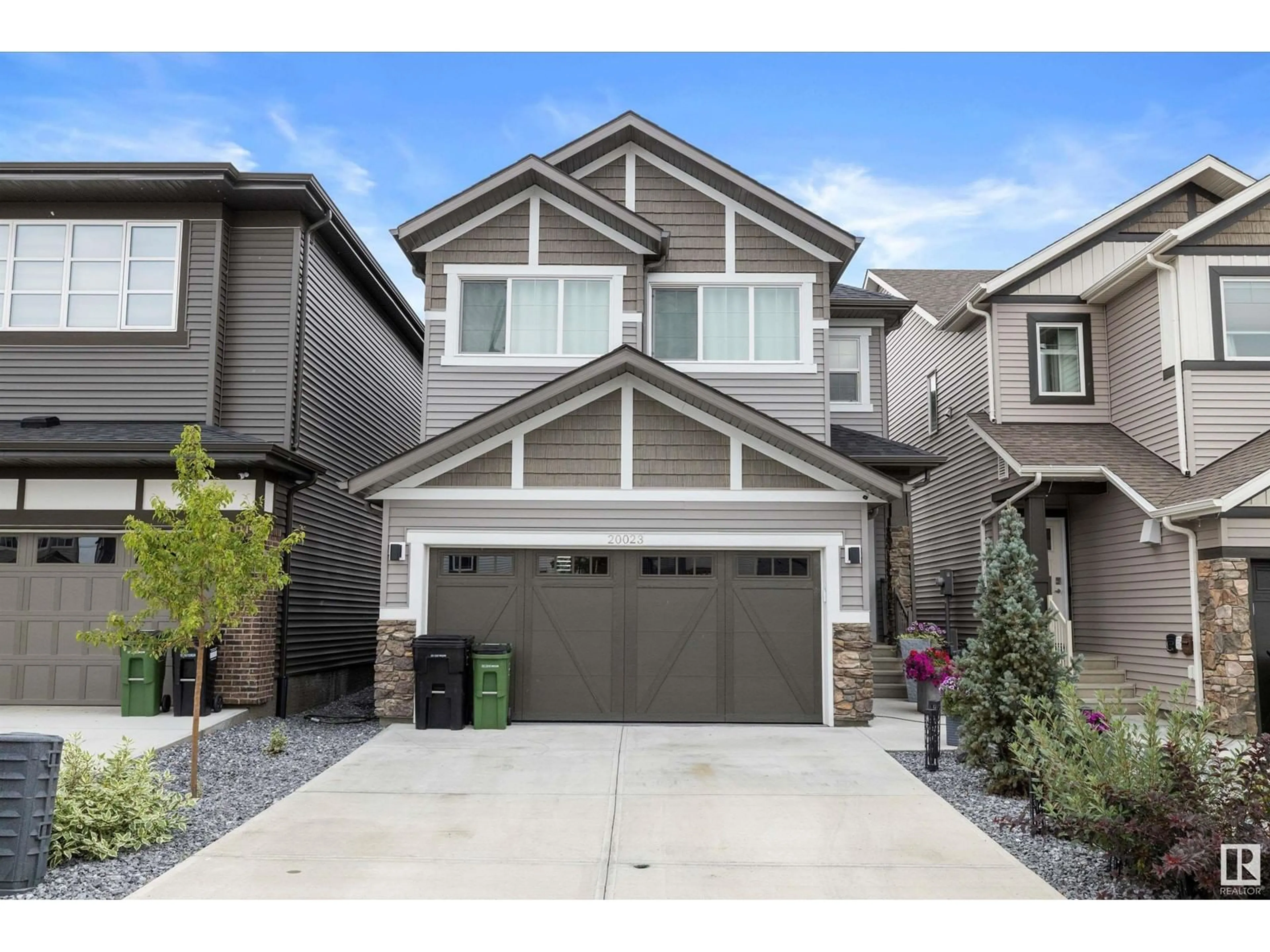 Home with vinyl exterior material, street for NW - 20023 26 AV, Edmonton Alberta T6M1K3