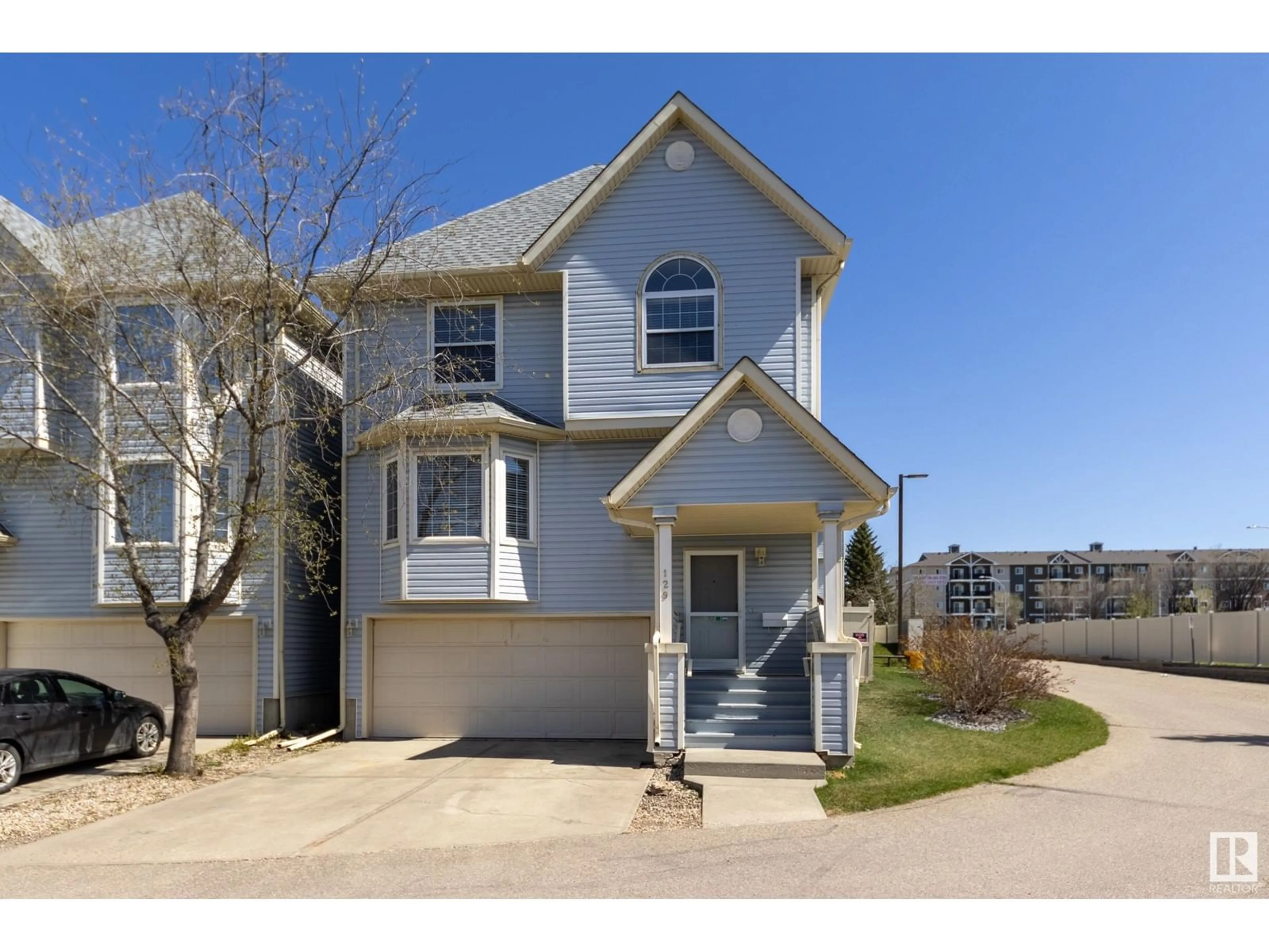 Home with vinyl exterior material, street for #129 - 1670 JAMHA RD, Edmonton Alberta T6L7B3