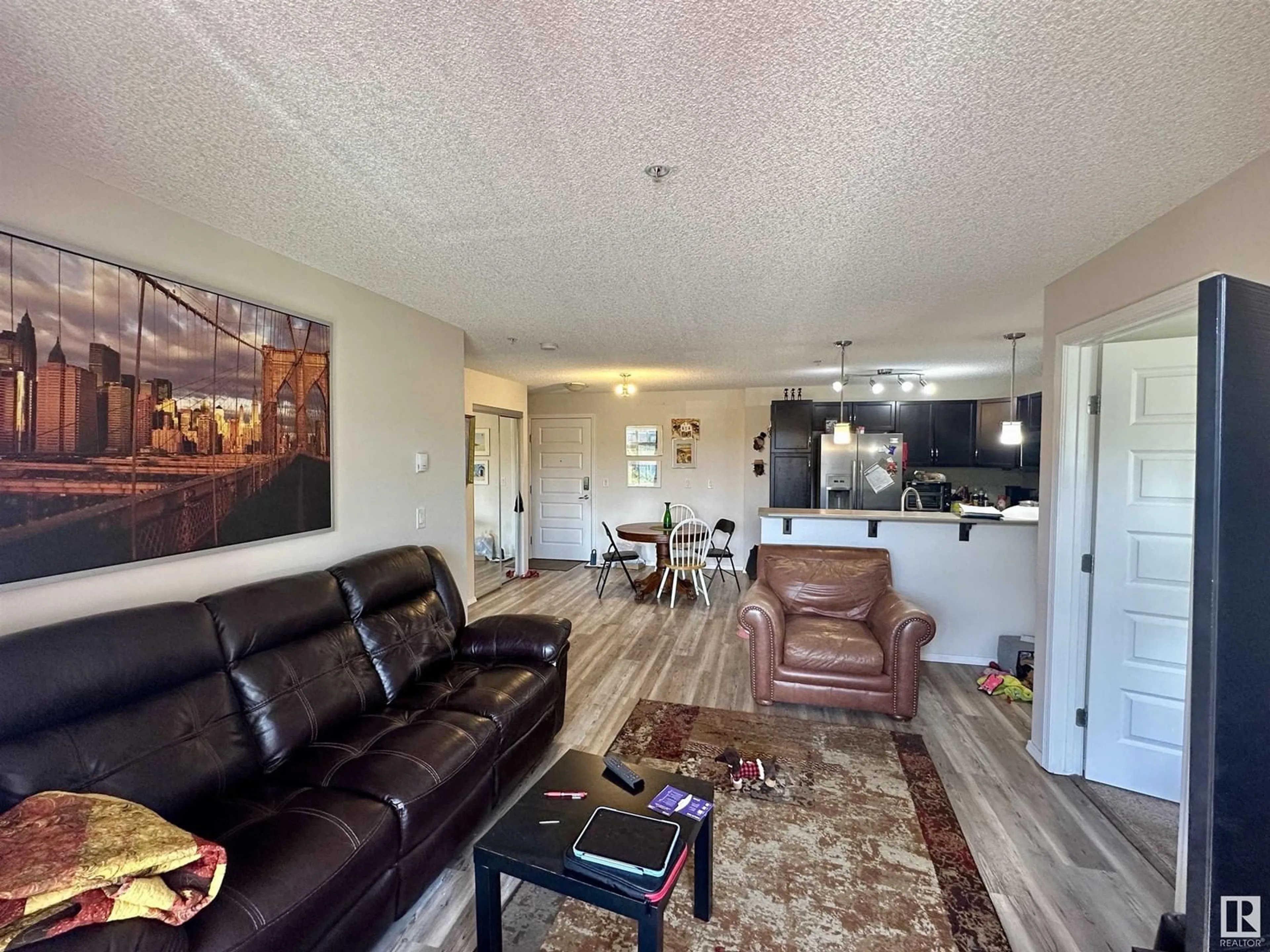 Living room with furniture, unknown for #209 - 6070 SCHONSEE WY, Edmonton Alberta T5Z0G8