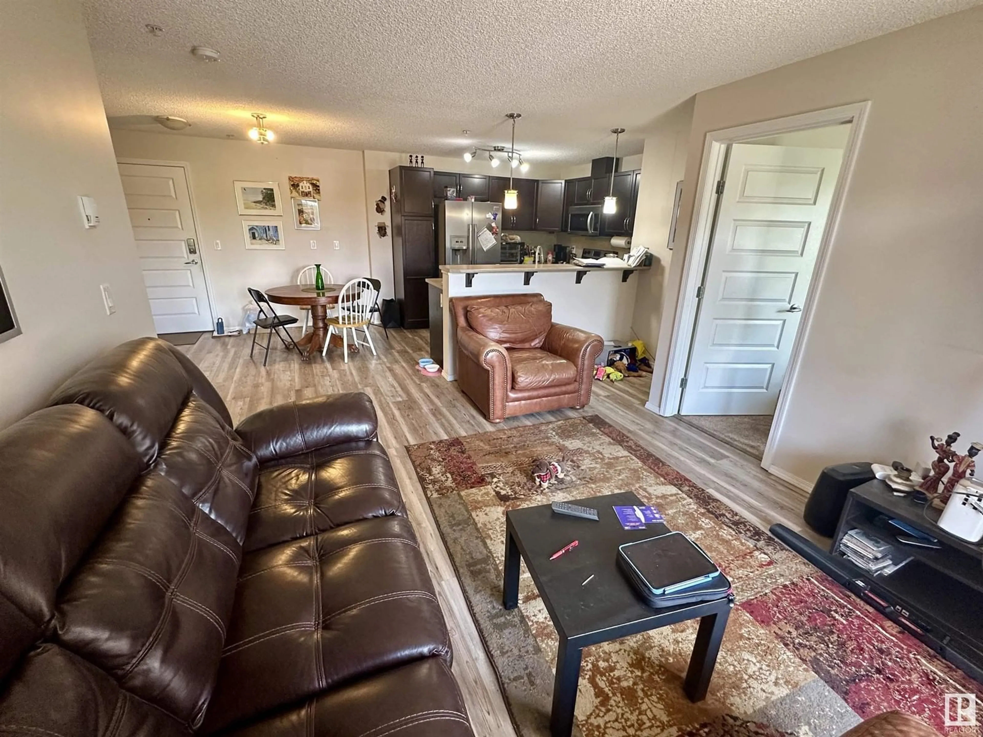 Living room with furniture, unknown for #209 - 6070 SCHONSEE WY, Edmonton Alberta T5Z0G8