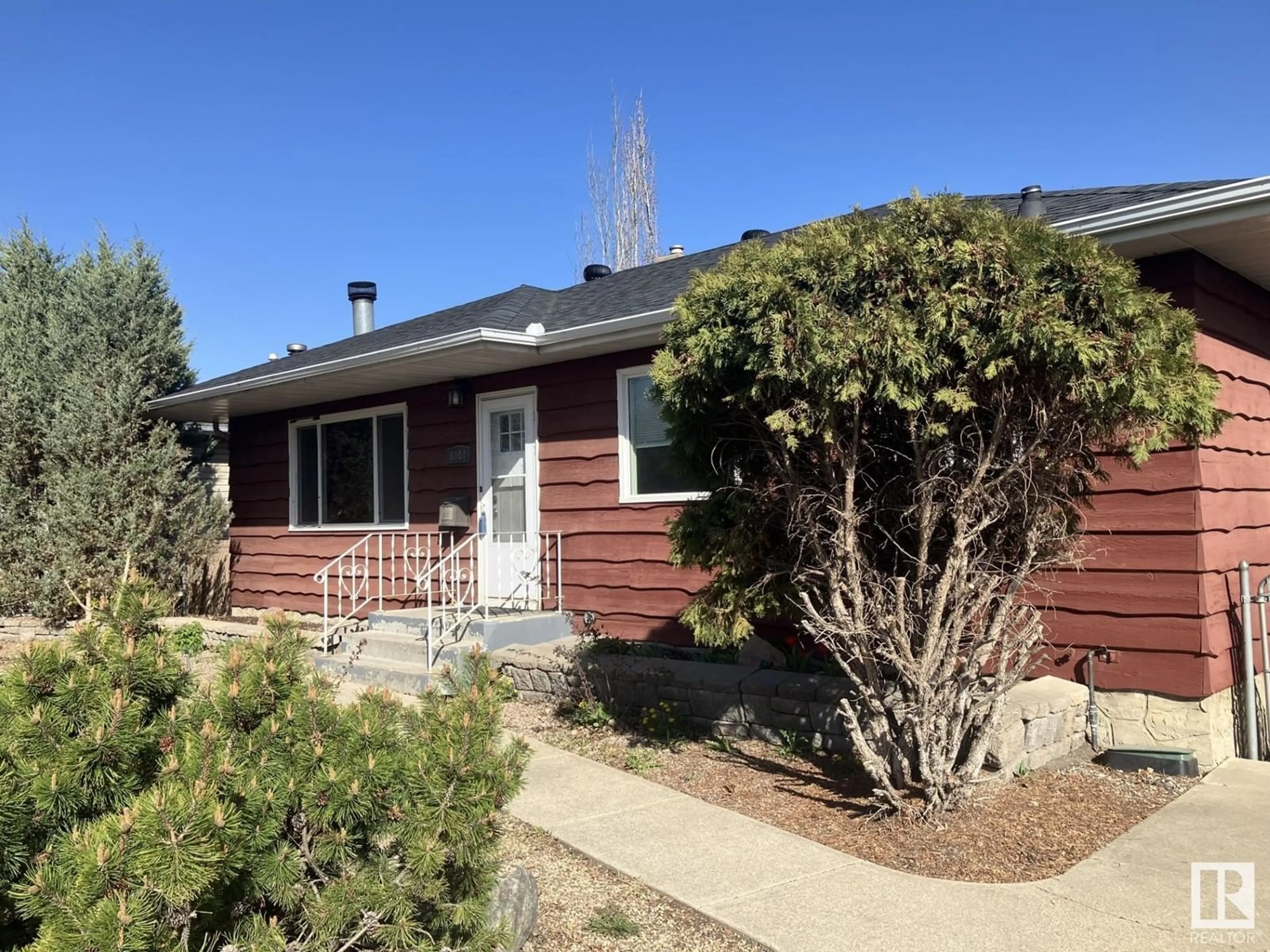 Home with vinyl exterior material, street for 6004 106 AVENUE, Edmonton Alberta T6A1G5