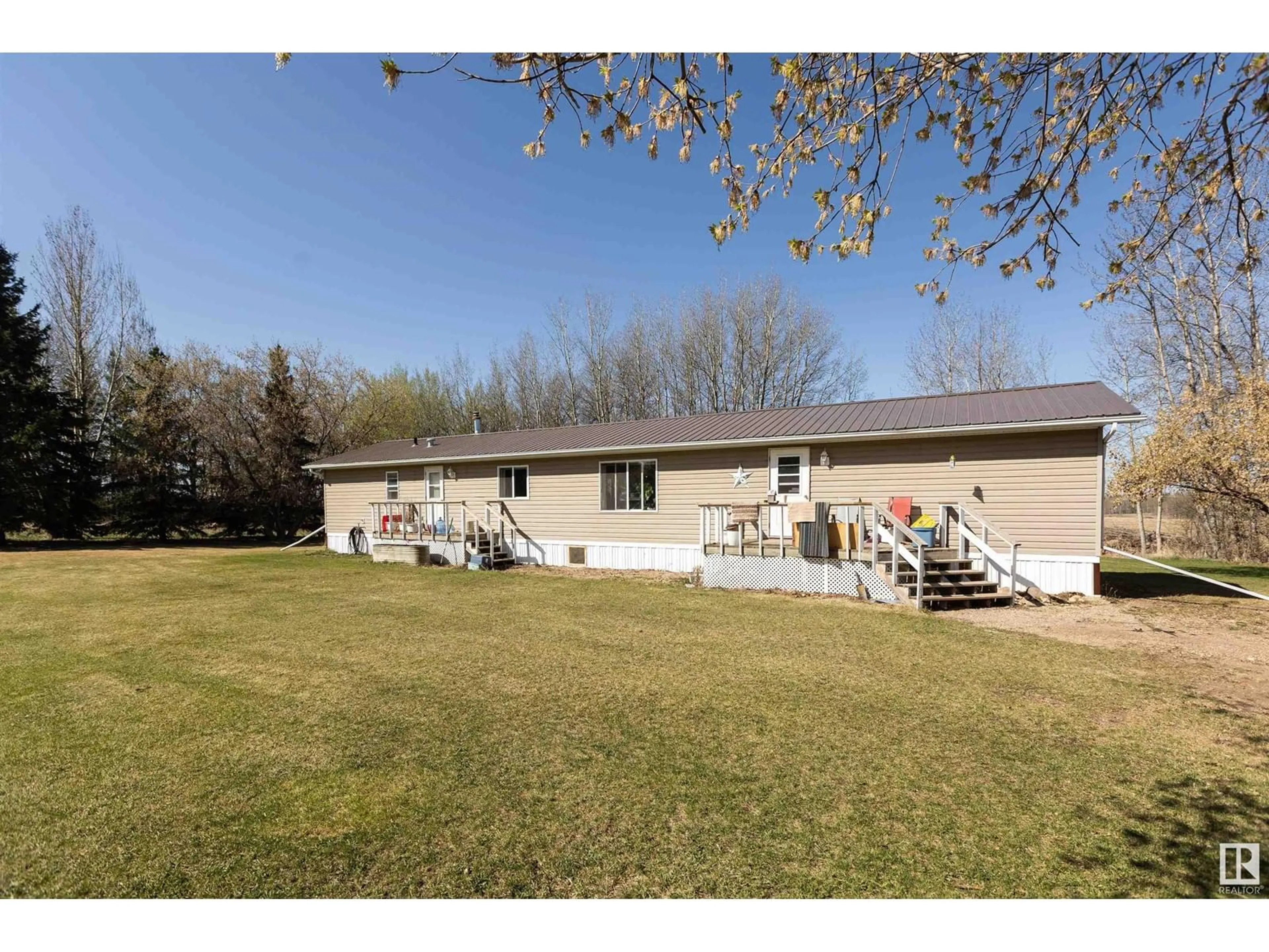 A pic from outside/outdoor area/front of a property/back of a property/a pic from drone, water/lake/river/ocean view for 62520 RR 264, Rural Westlock County Alberta T7P2P6