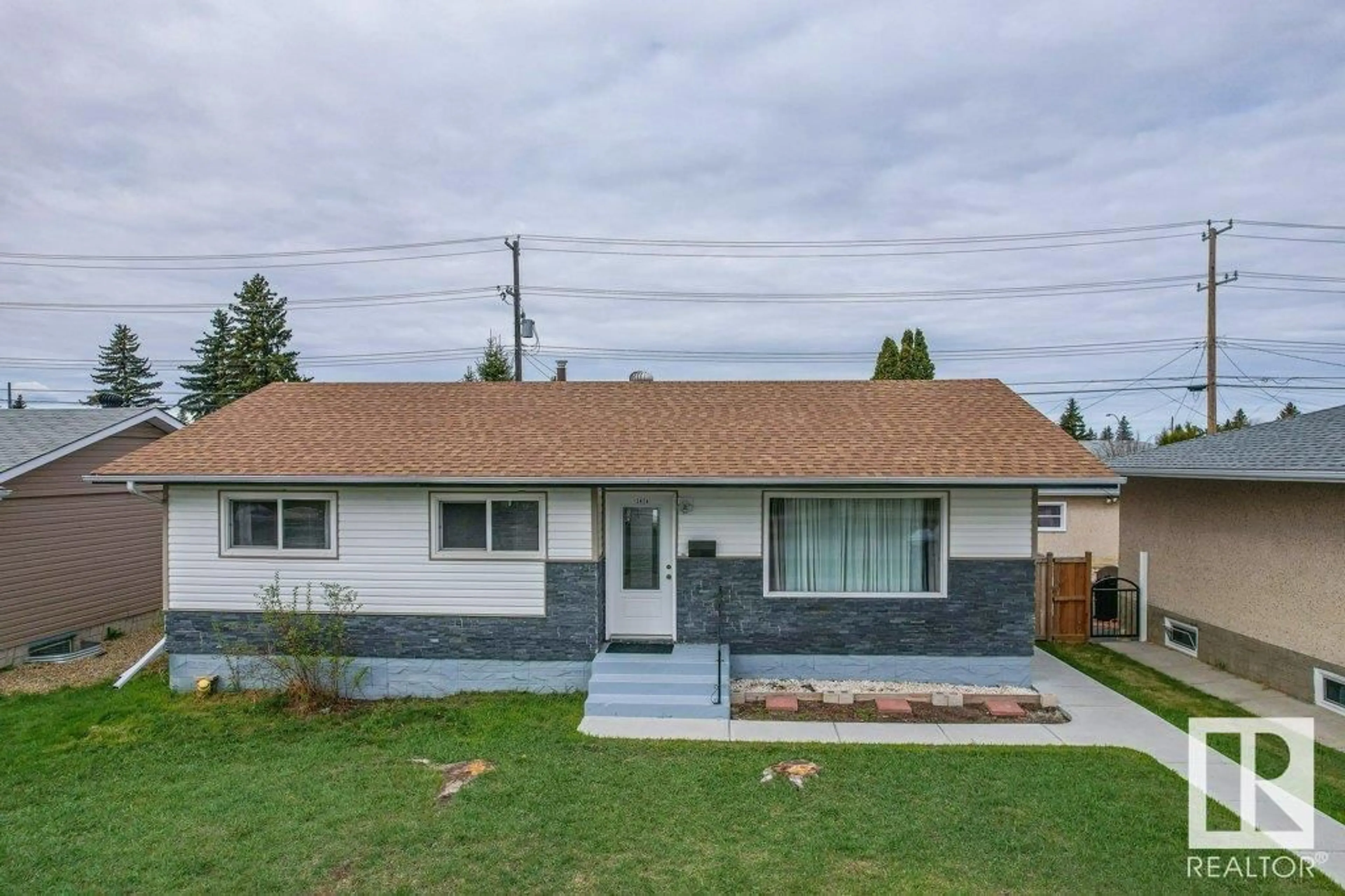 Home with vinyl exterior material, street for NW - 13424 82 ST, Edmonton Alberta T5E2V2