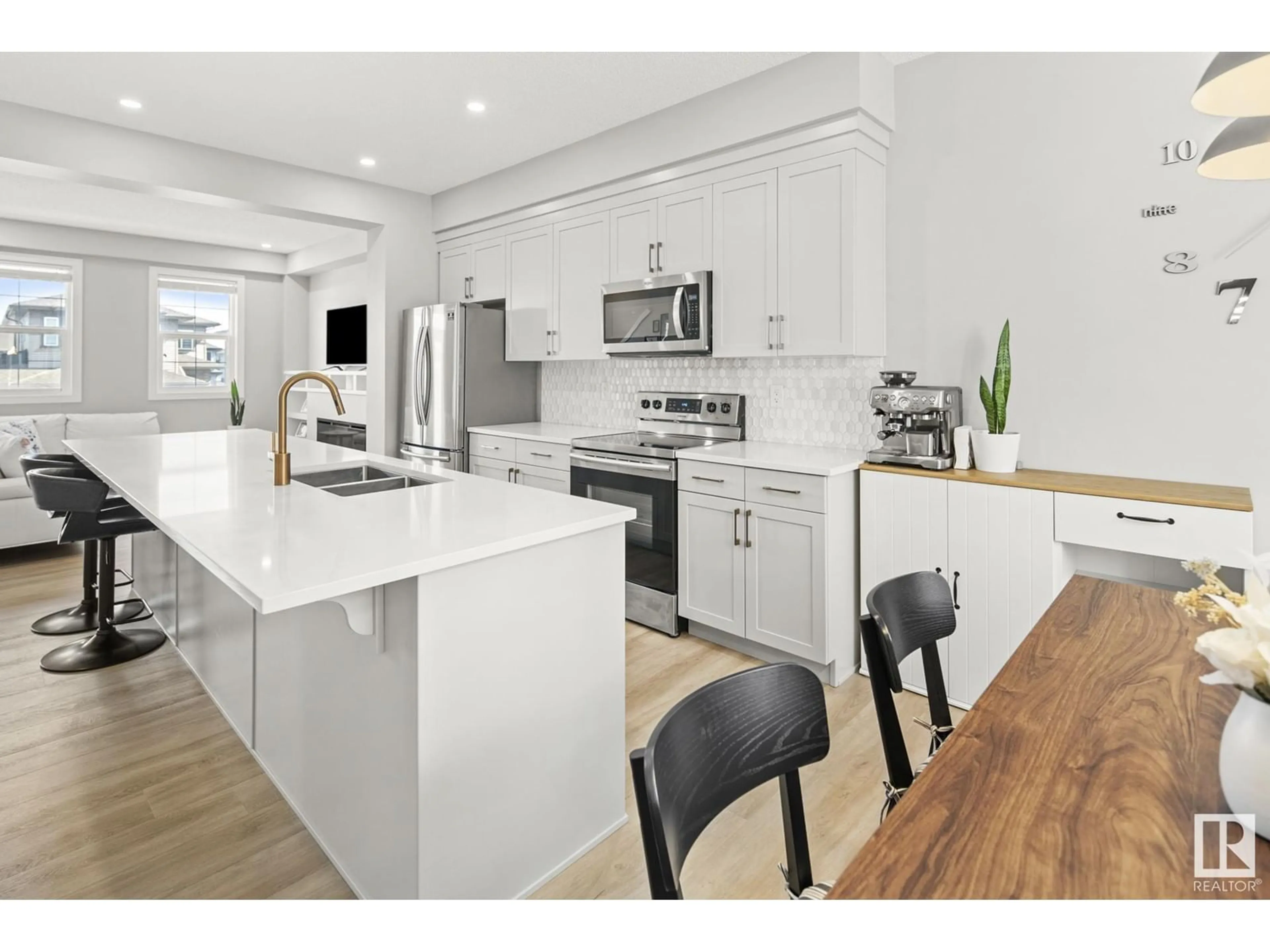 Open concept kitchen, wood/laminate floor for 2088 WONNACOTT WY, Edmonton Alberta T6X2V7