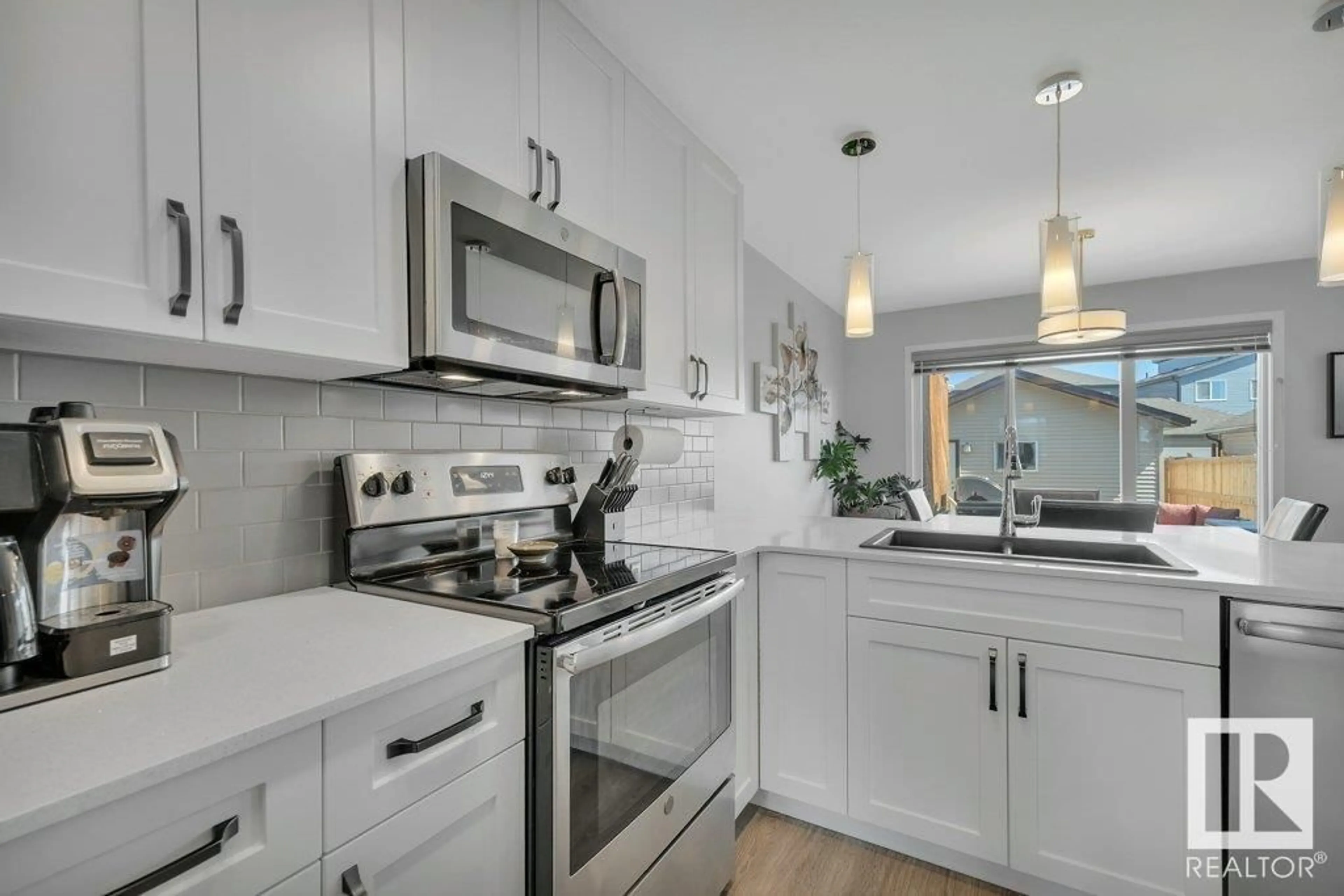 Open concept kitchen, ceramic/tile floor for 1057 PAISLEY DR, Edmonton Alberta T6W4E1