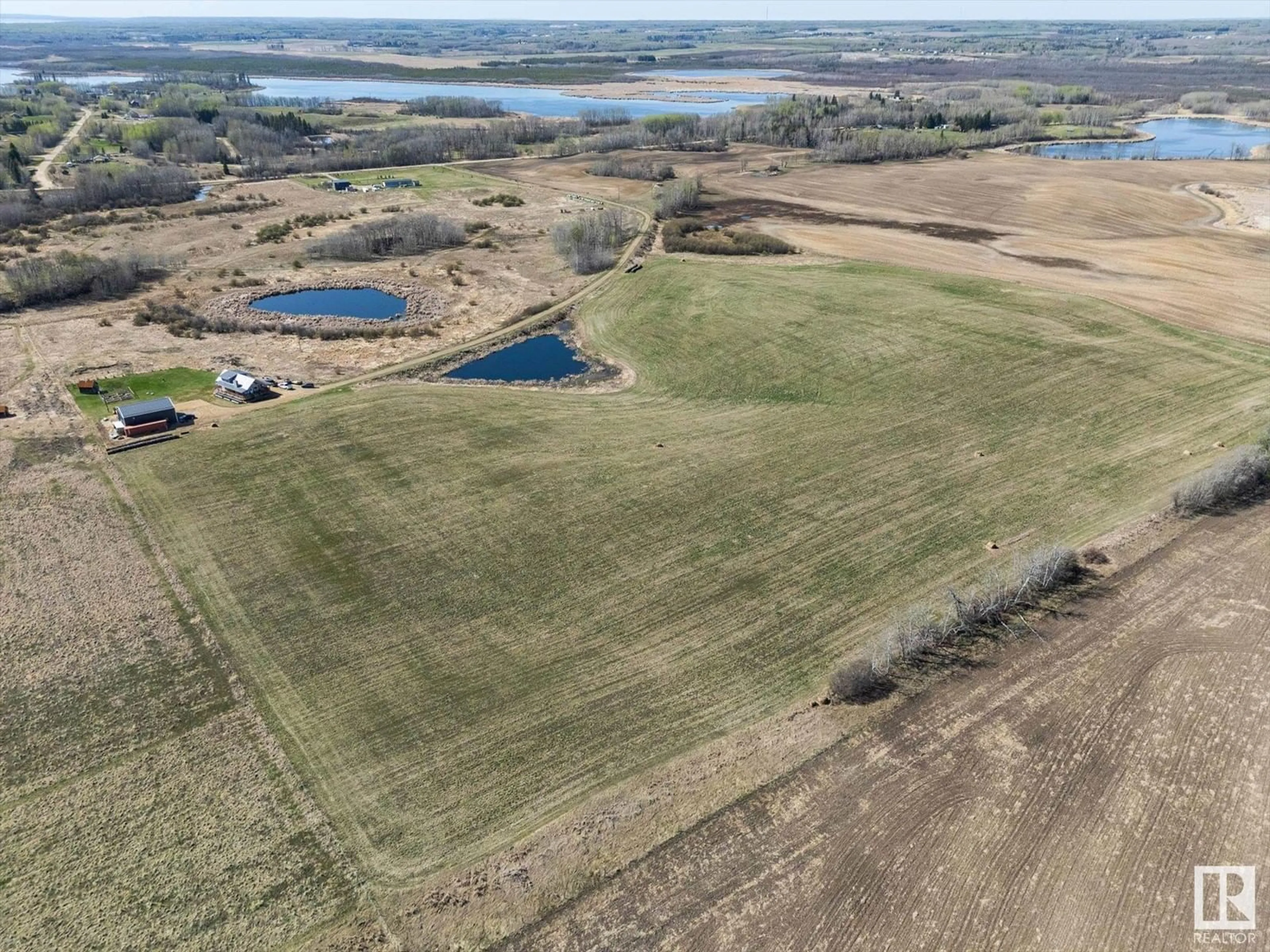 A pic from outside/outdoor area/front of a property/back of a property/a pic from drone, water/lake/river/ocean view for 52515 RGE ROAD 25, Rural Parkland County Alberta T7Y2M2