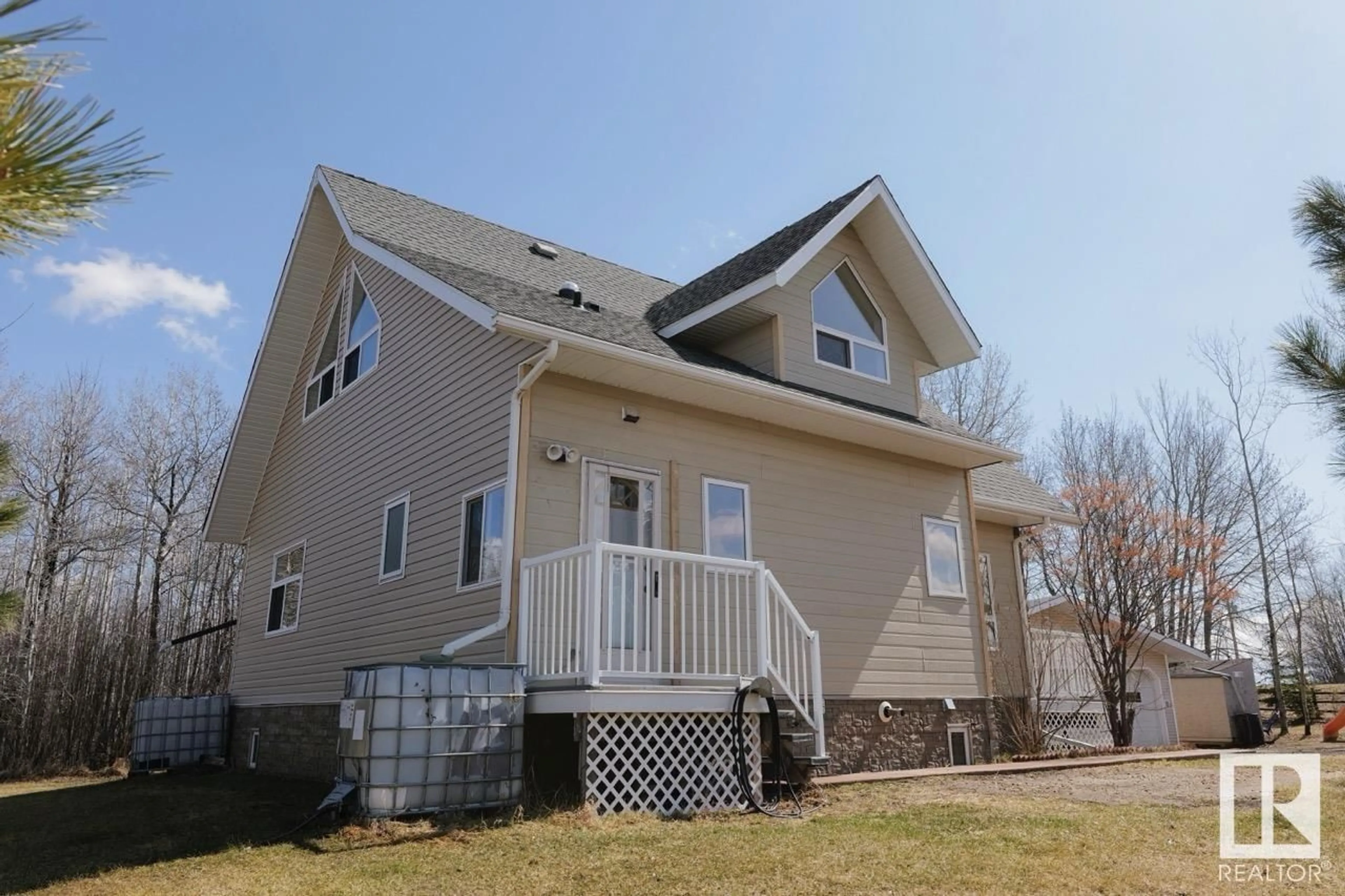 Home with vinyl exterior material, street for 220 RR 55, Rural Barrhead County Alberta T7N1N3