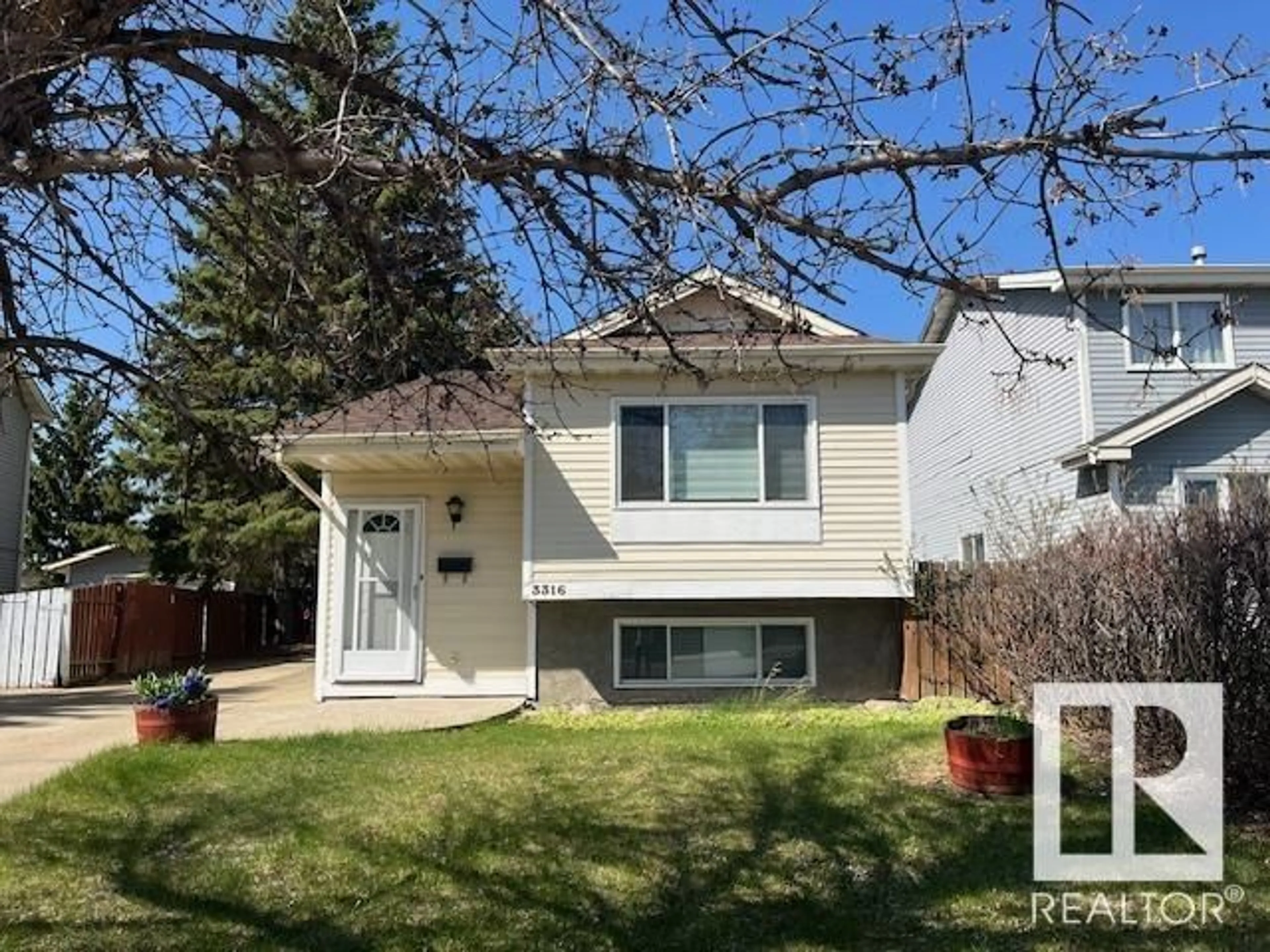 Home with vinyl exterior material, street for 3316 46 ST, Edmonton Alberta T6L4X4
