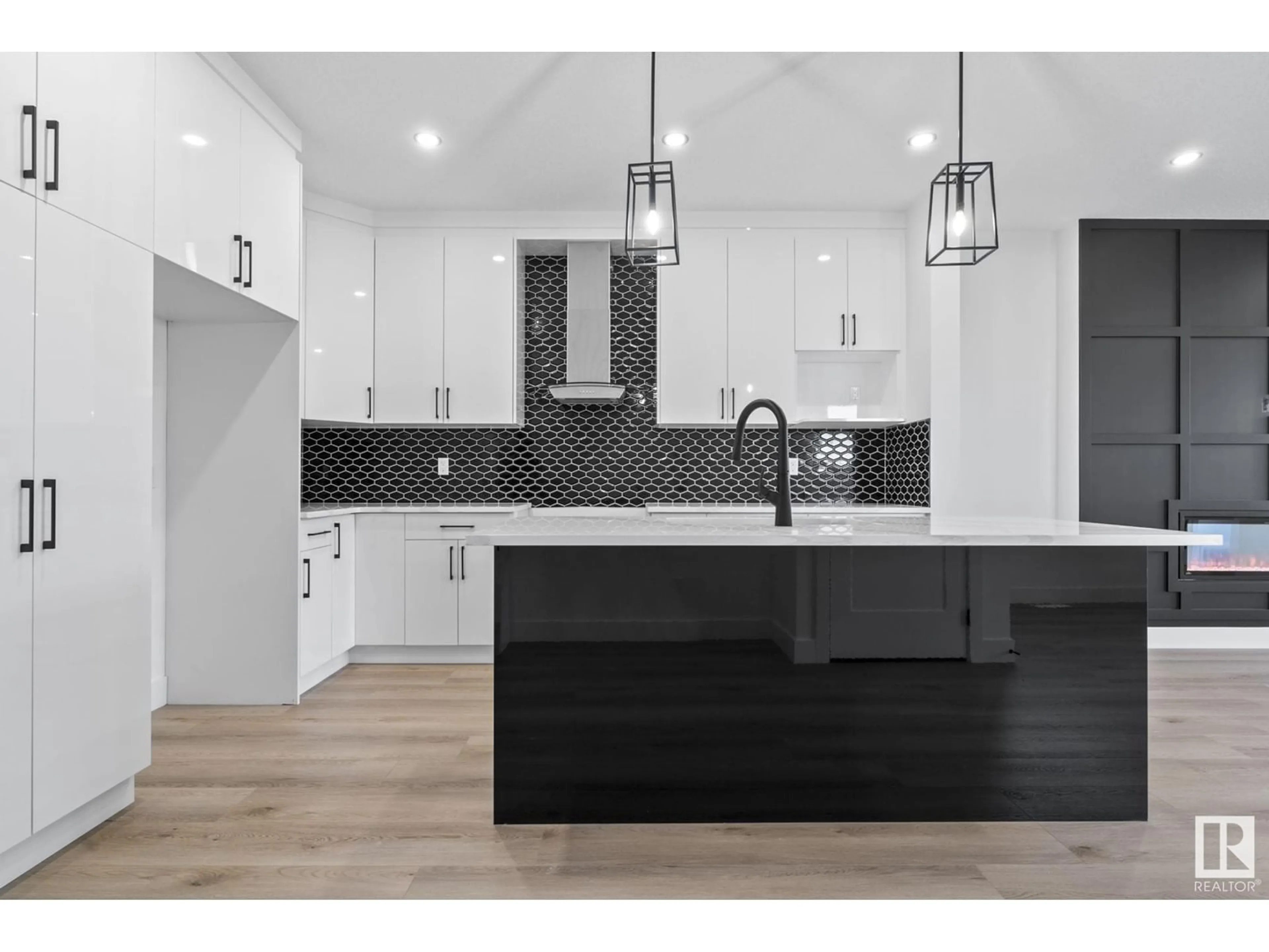 Open concept kitchen, wood/laminate floor for 707 31 AV, Edmonton Alberta T6T2V6