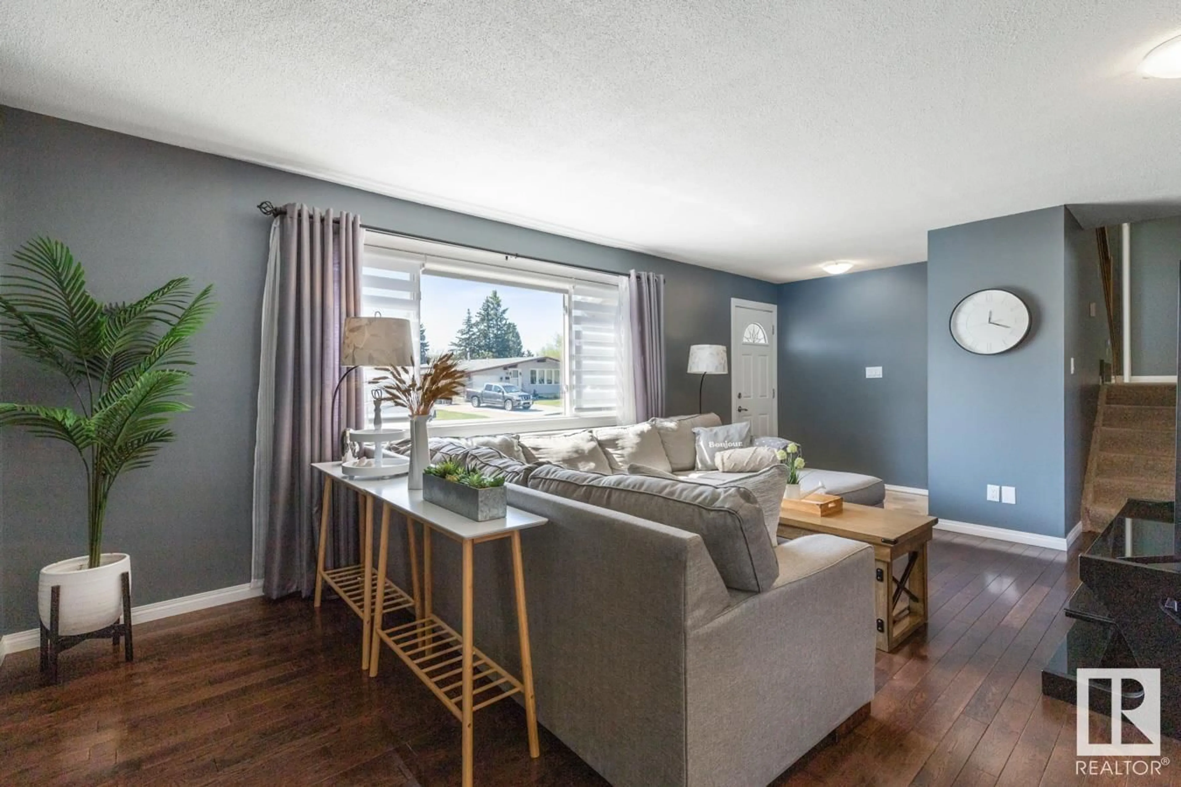 Living room with furniture, wood/laminate floor for 15 MELROSE CR, Sherwood Park Alberta T8A3T9
