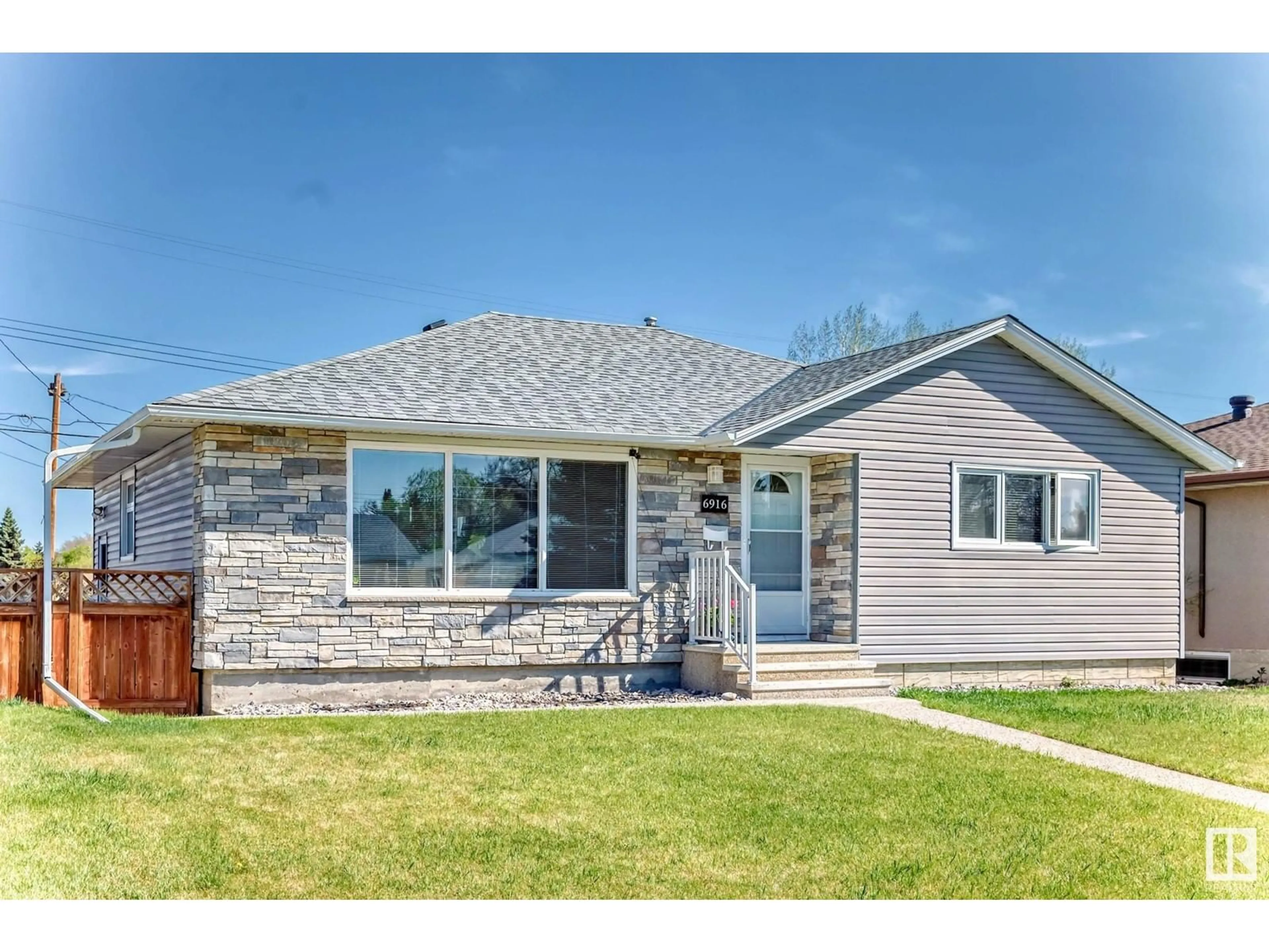 Home with vinyl exterior material, street for 6916 98A AV, Edmonton Alberta T6A0C1