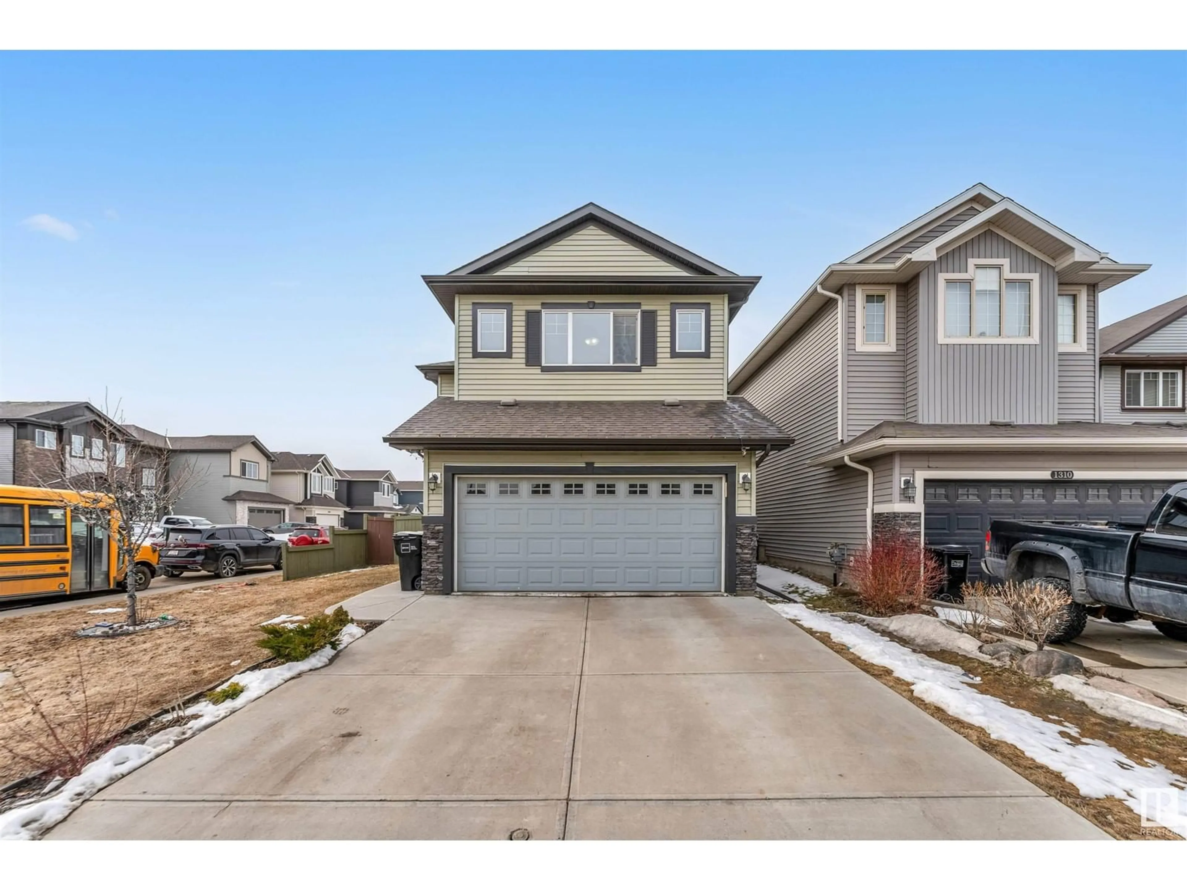 Home with vinyl exterior material, street for 1306 32A ST, Edmonton Alberta T6T0Z3