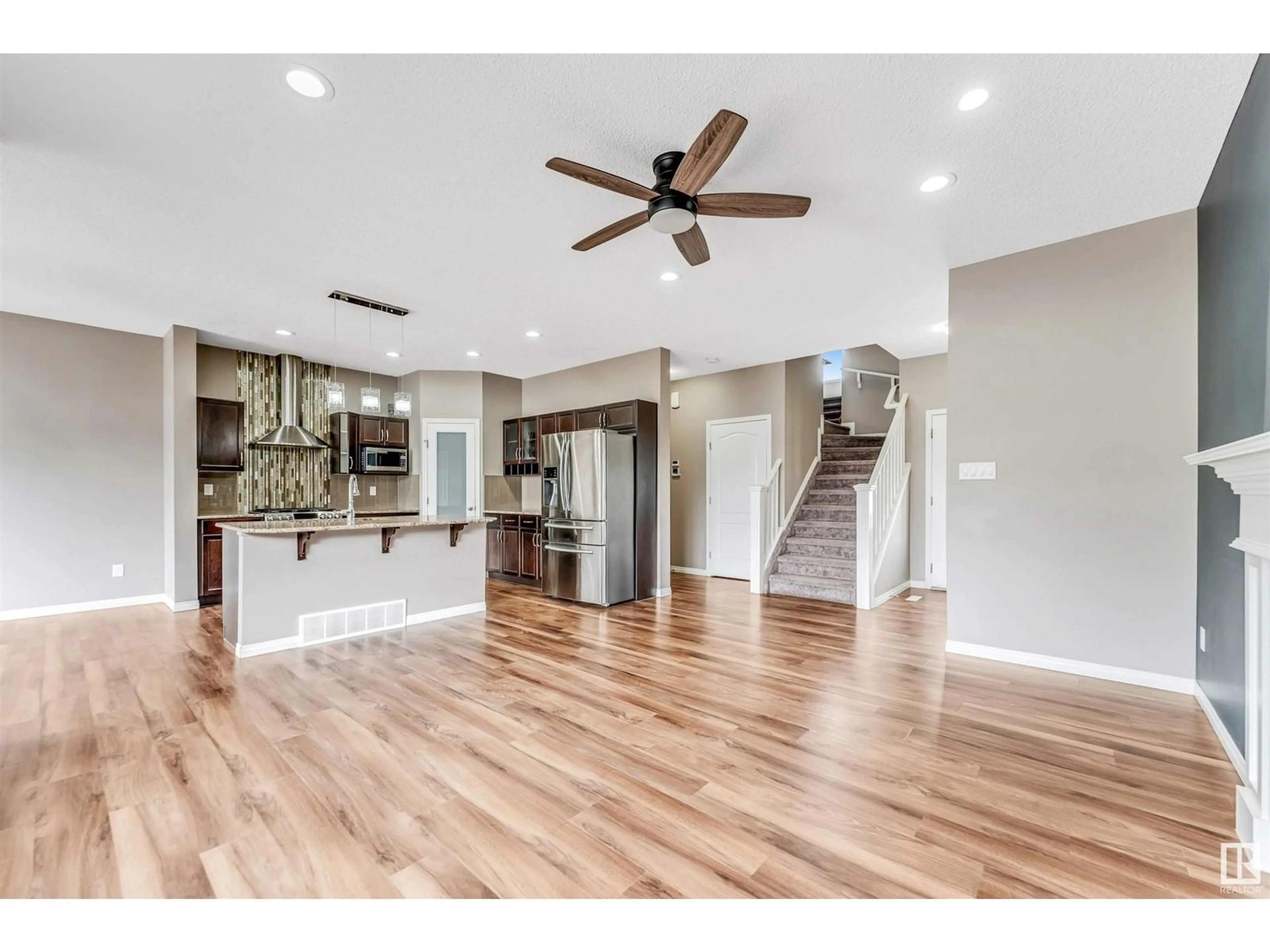 Open concept kitchen, wood/laminate floor for 1306 32A ST, Edmonton Alberta T6T0Z3