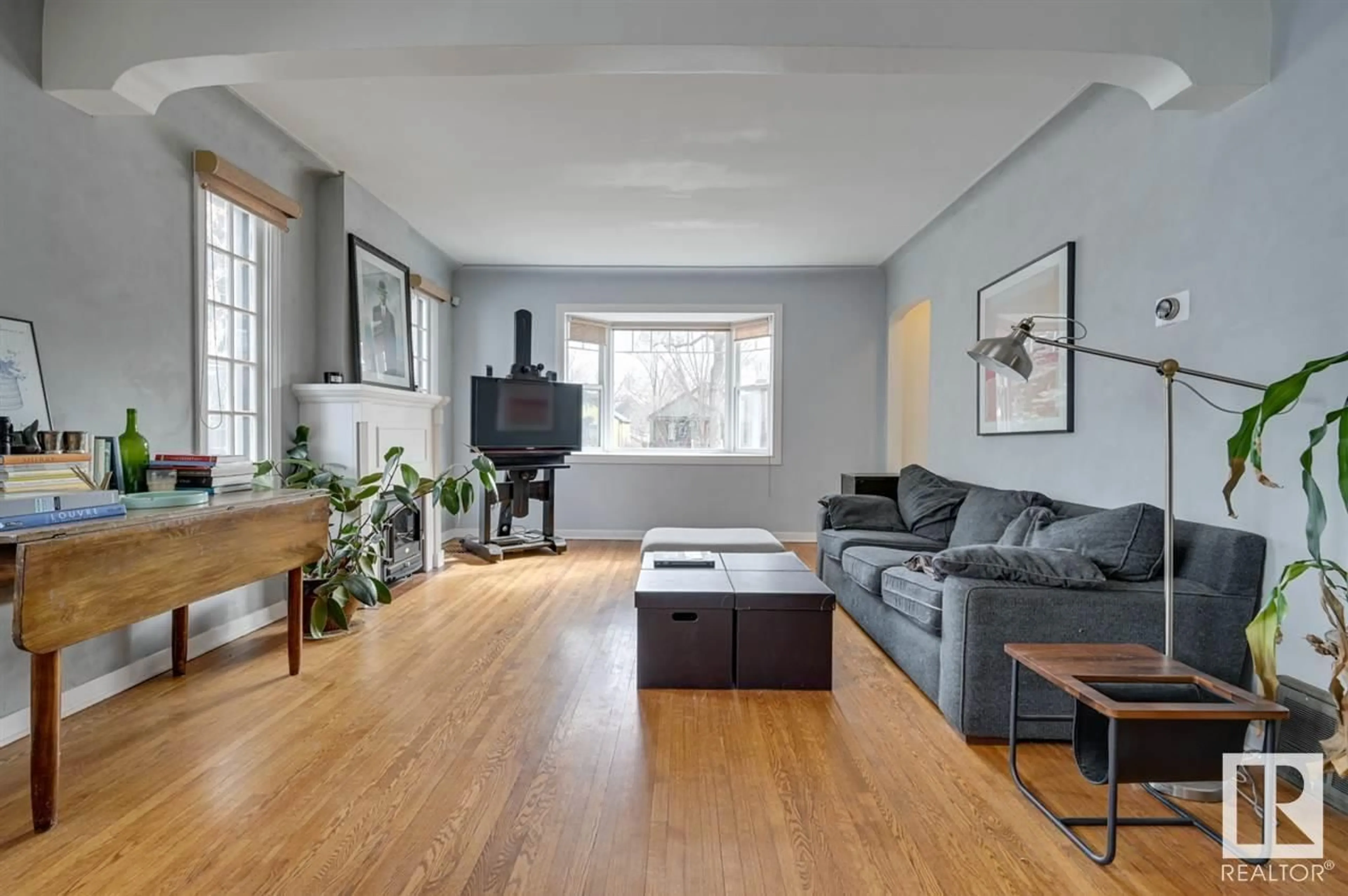 Living room with furniture, wood/laminate floor for 10038 88 AV, Edmonton Alberta T6E2R7