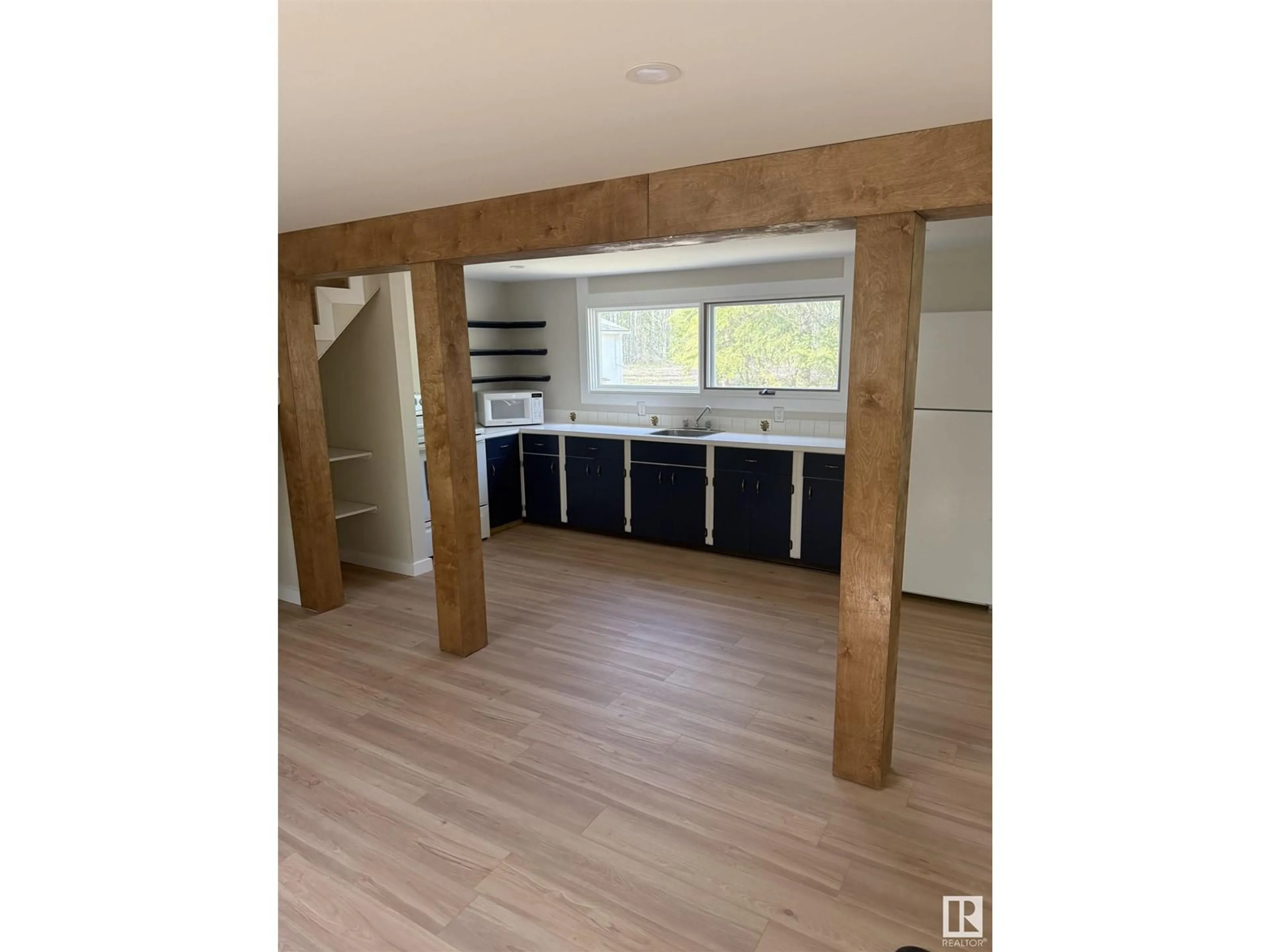 Open concept kitchen, wood/laminate floor for 66 TWP ROAD 480, Rural Wetaskiwin County Alberta T0C2P0