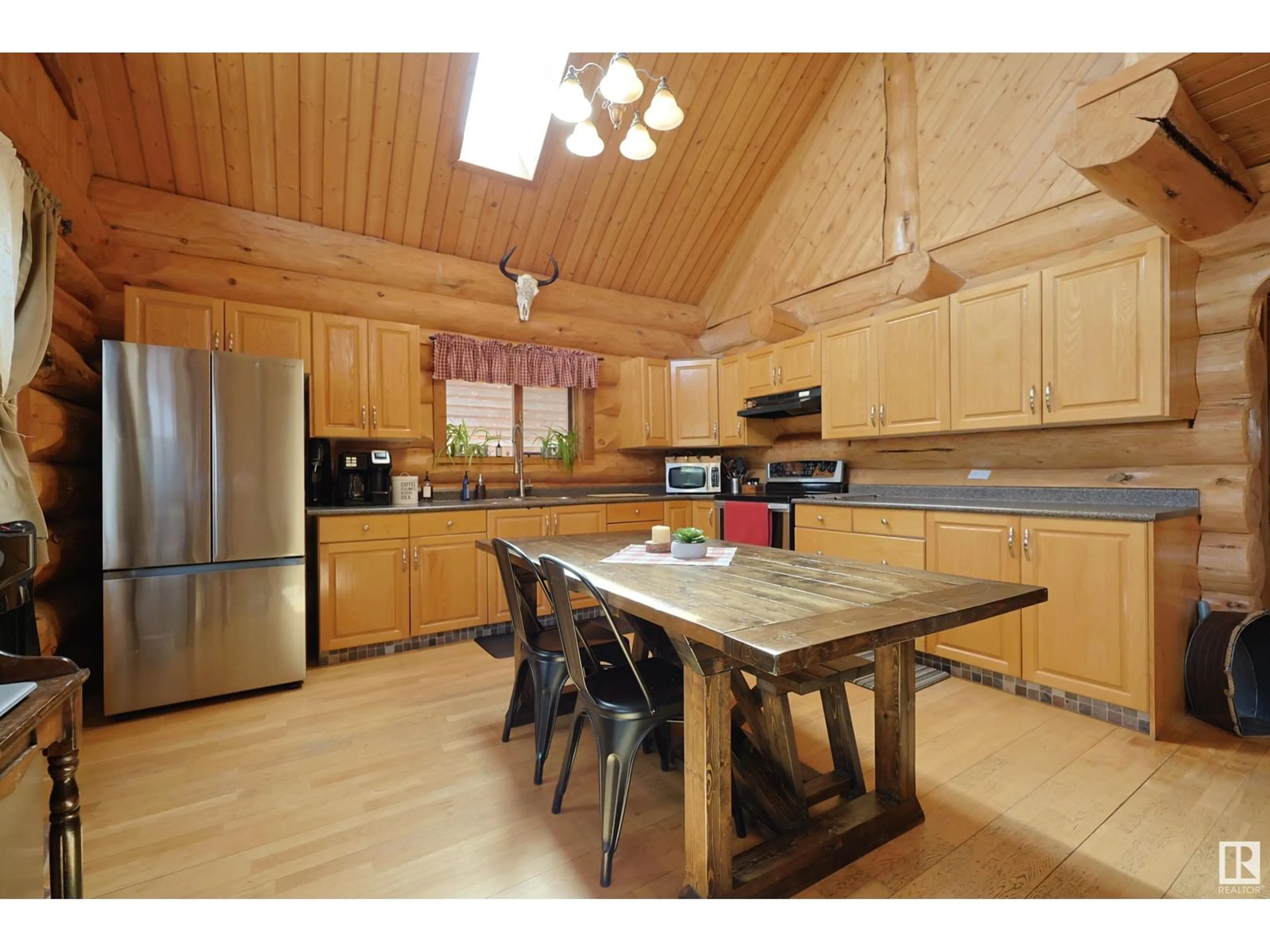 Open concept kitchen, wood/laminate floor for 1134 11 ST, Rural Lac Ste. Anne County Alberta T0E0L0