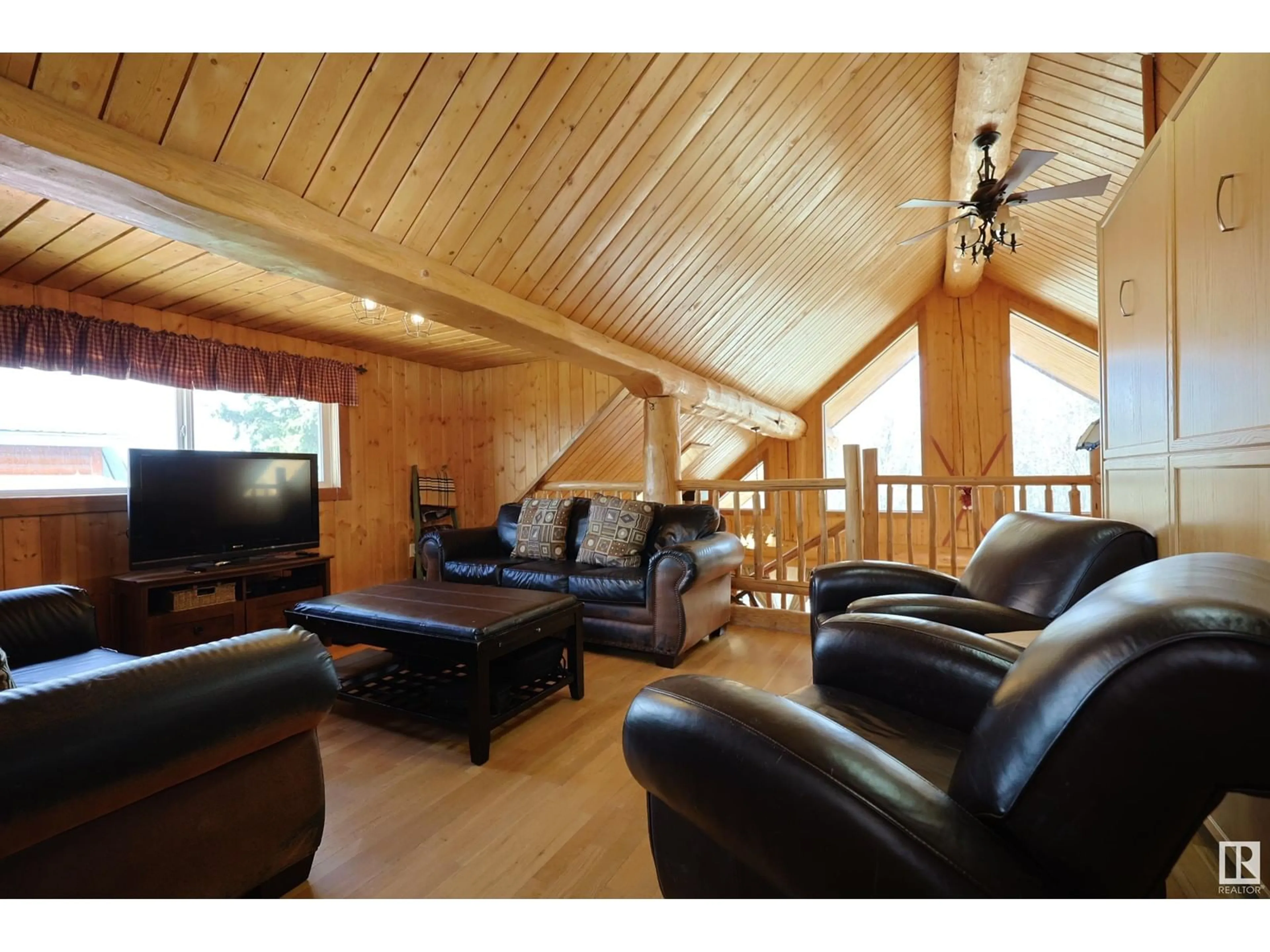 Living room with furniture, wood/laminate floor for 1134 11 ST, Rural Lac Ste. Anne County Alberta T0E0L0