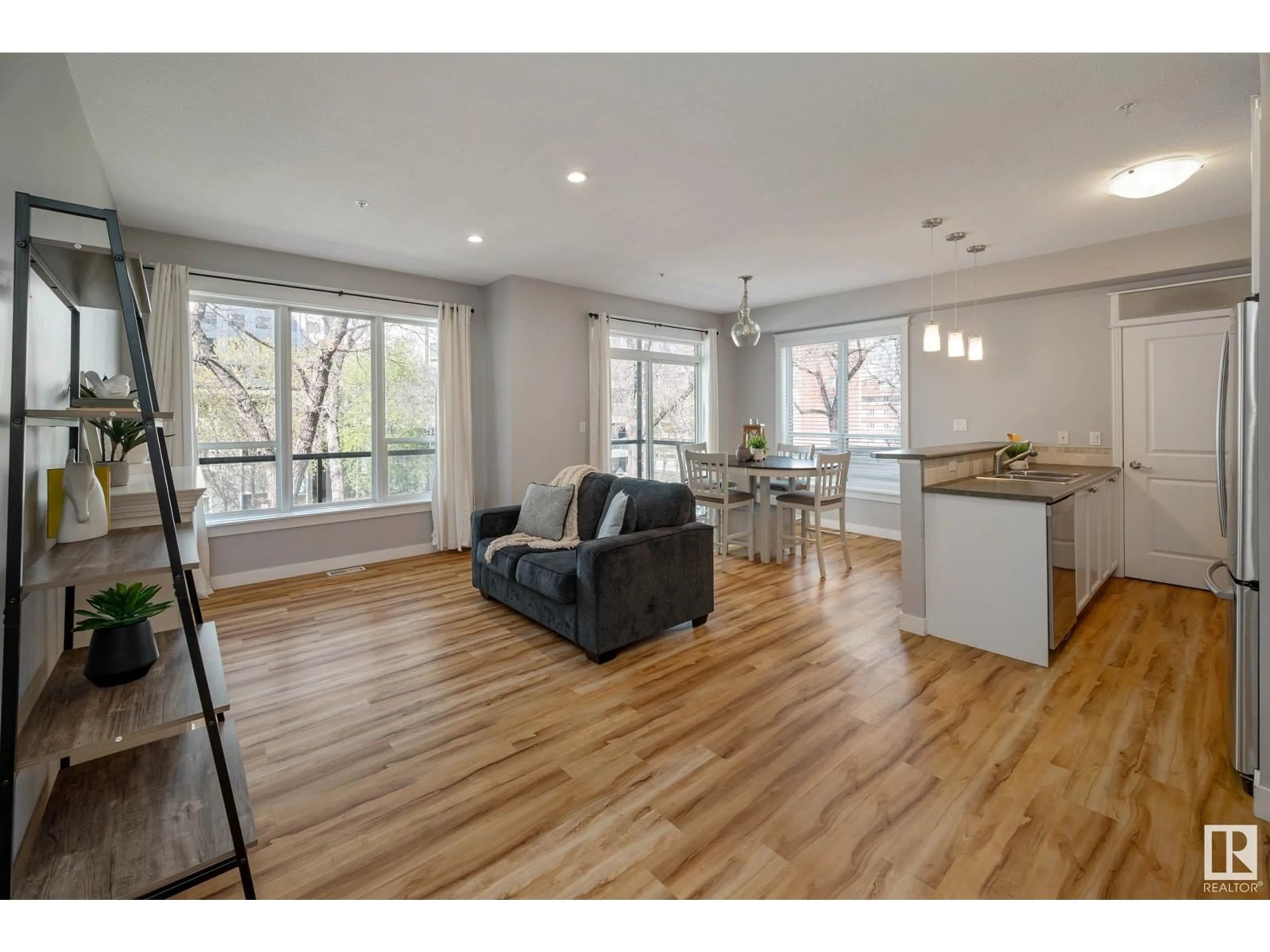 Open concept kitchen, wood/laminate floor for #214 - 10033 110 ST, Edmonton Alberta T5K1J5