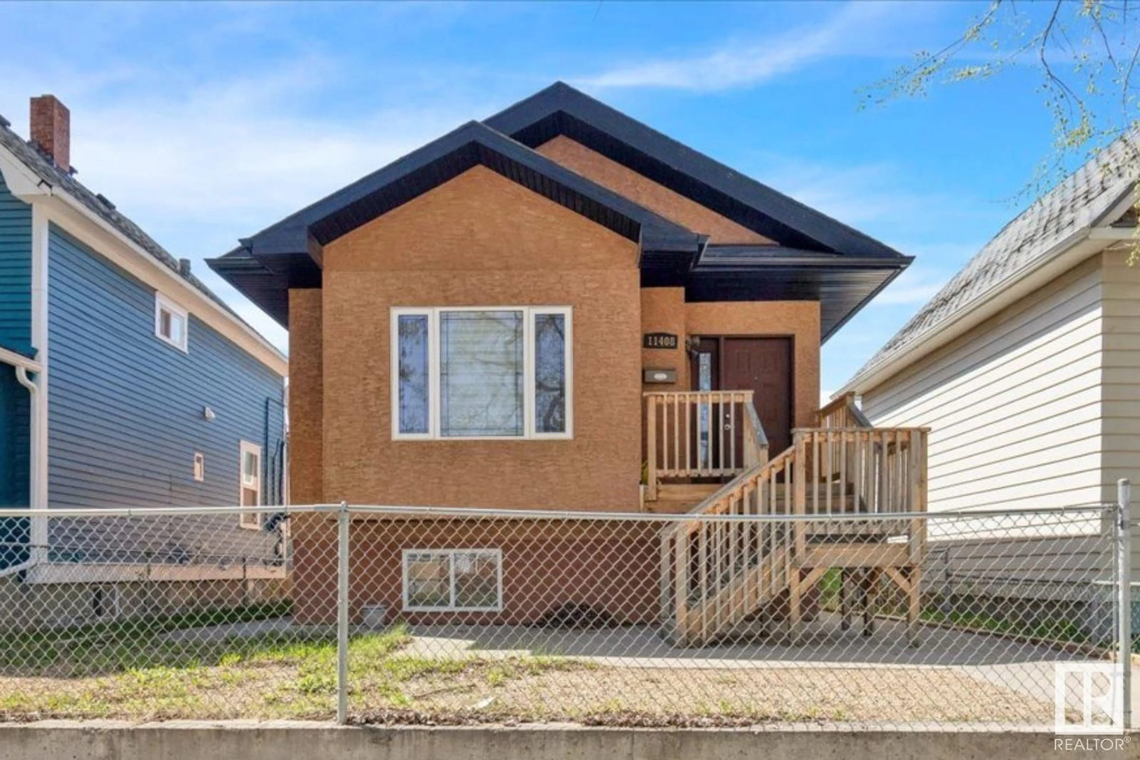 Home with brick exterior material, street for NW - 11408 91 ST, Edmonton Alberta T5B4A5