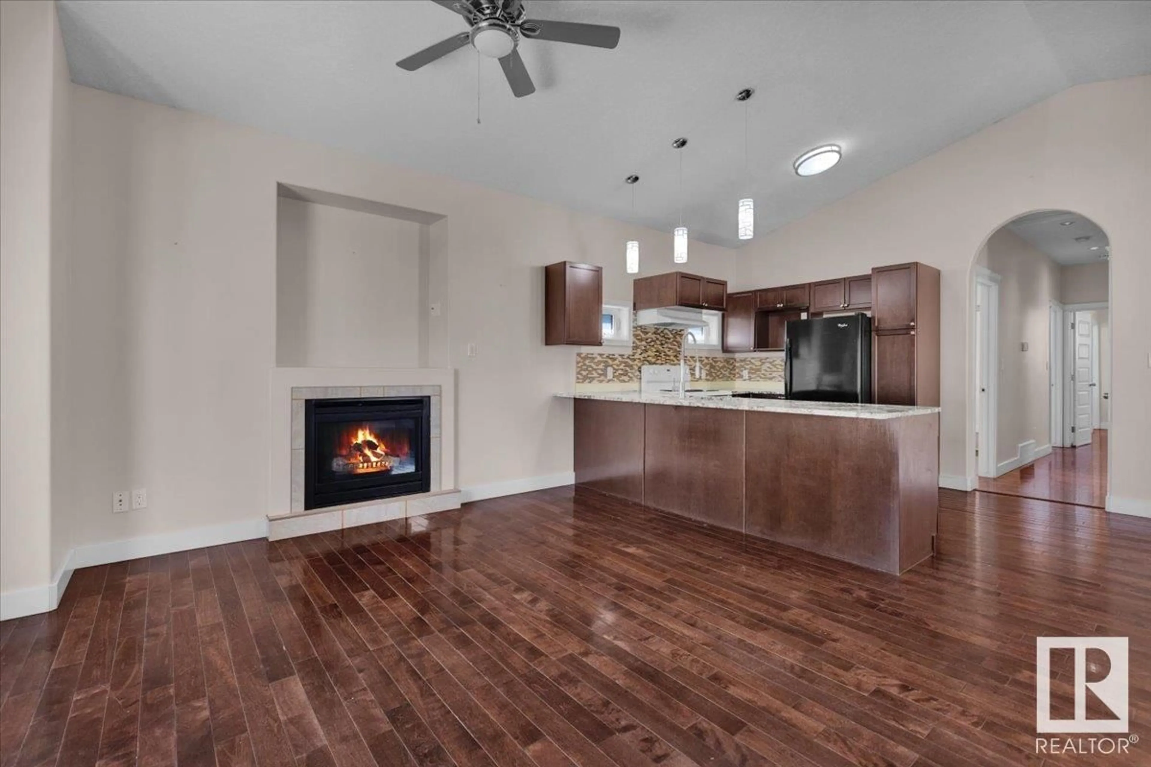 Open concept kitchen, wood/laminate floor for NW - 11408 91 ST, Edmonton Alberta T5B4A5