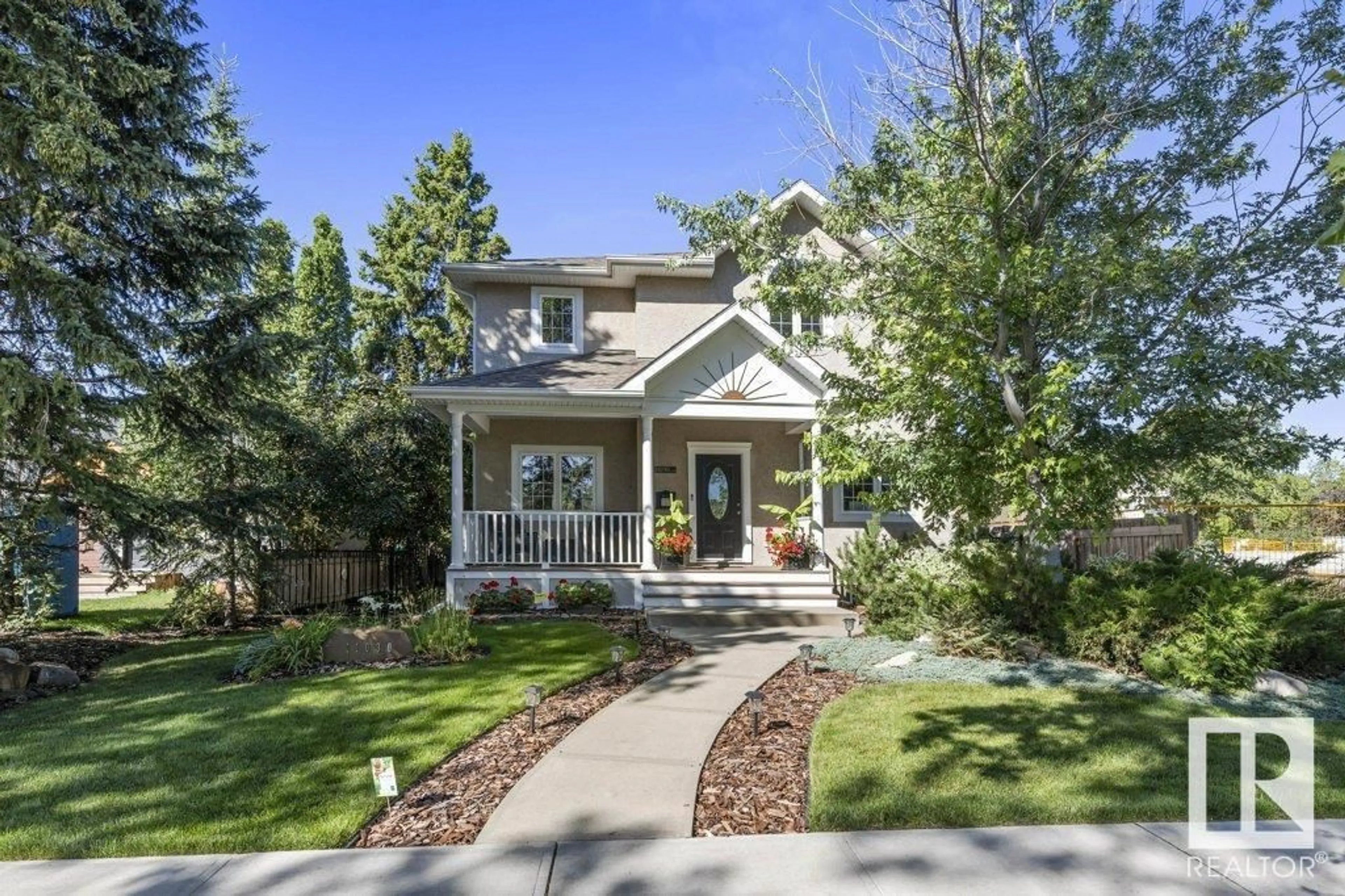 Home with vinyl exterior material, street for NW - 11030 122 ST, Edmonton Alberta T5M0B3