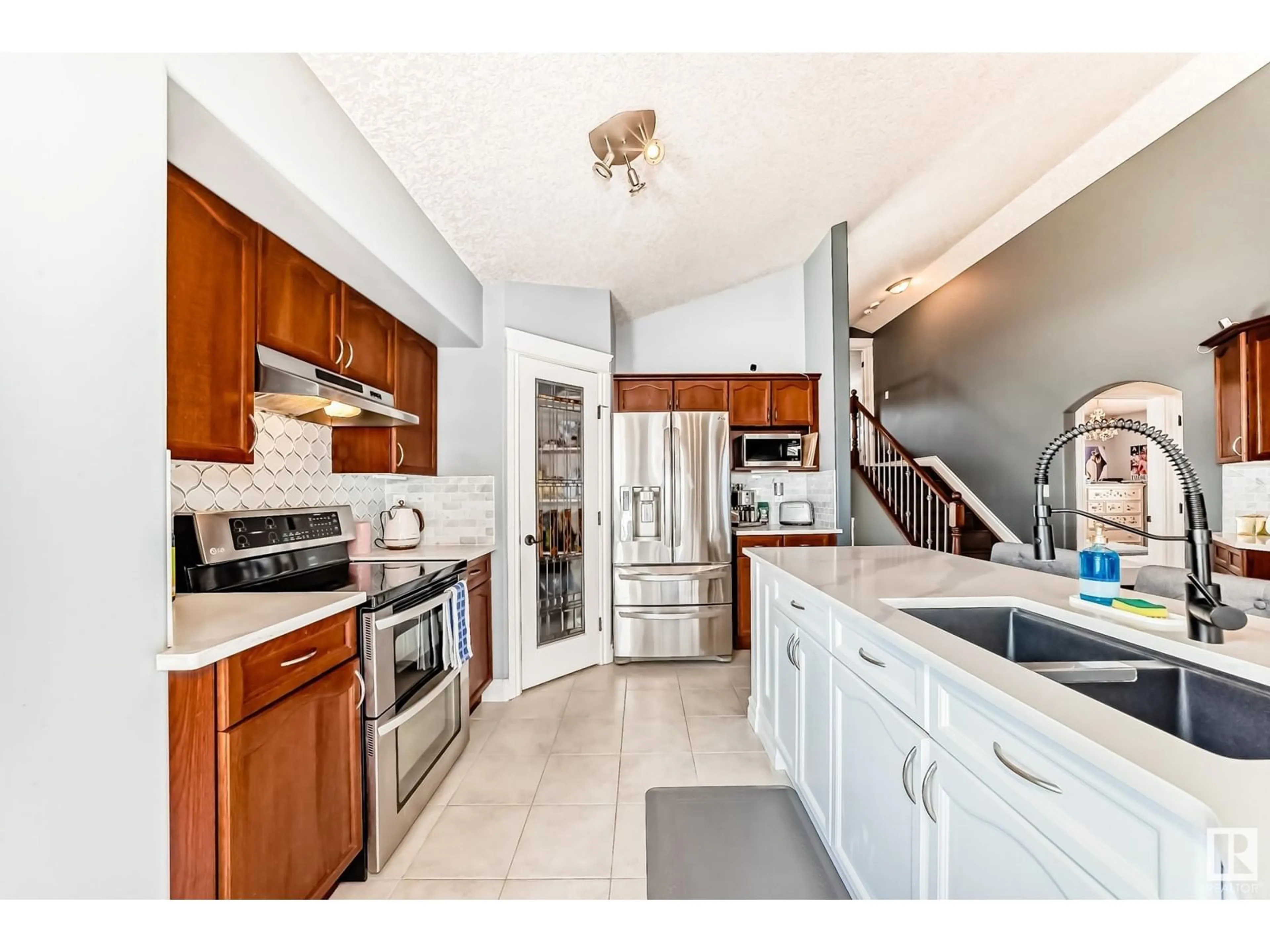 Open concept kitchen, ceramic/tile floor for 4708 164 AV, Edmonton Alberta T5Y0A5