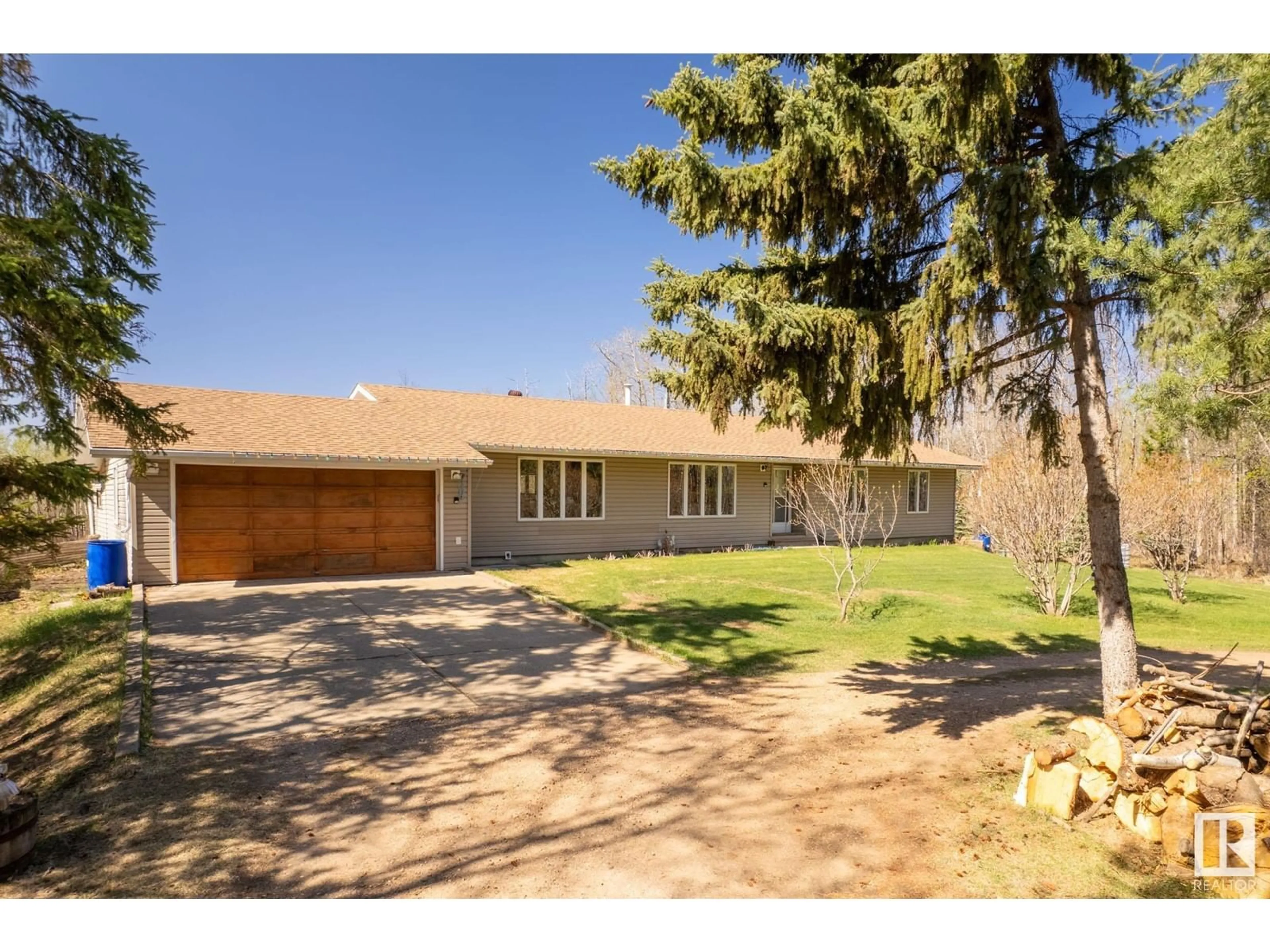 A pic from outside/outdoor area/front of a property/back of a property/a pic from drone, street for 19 - 56420 RGE ROAD 231, Rural Sturgeon County Alberta T0A1N4