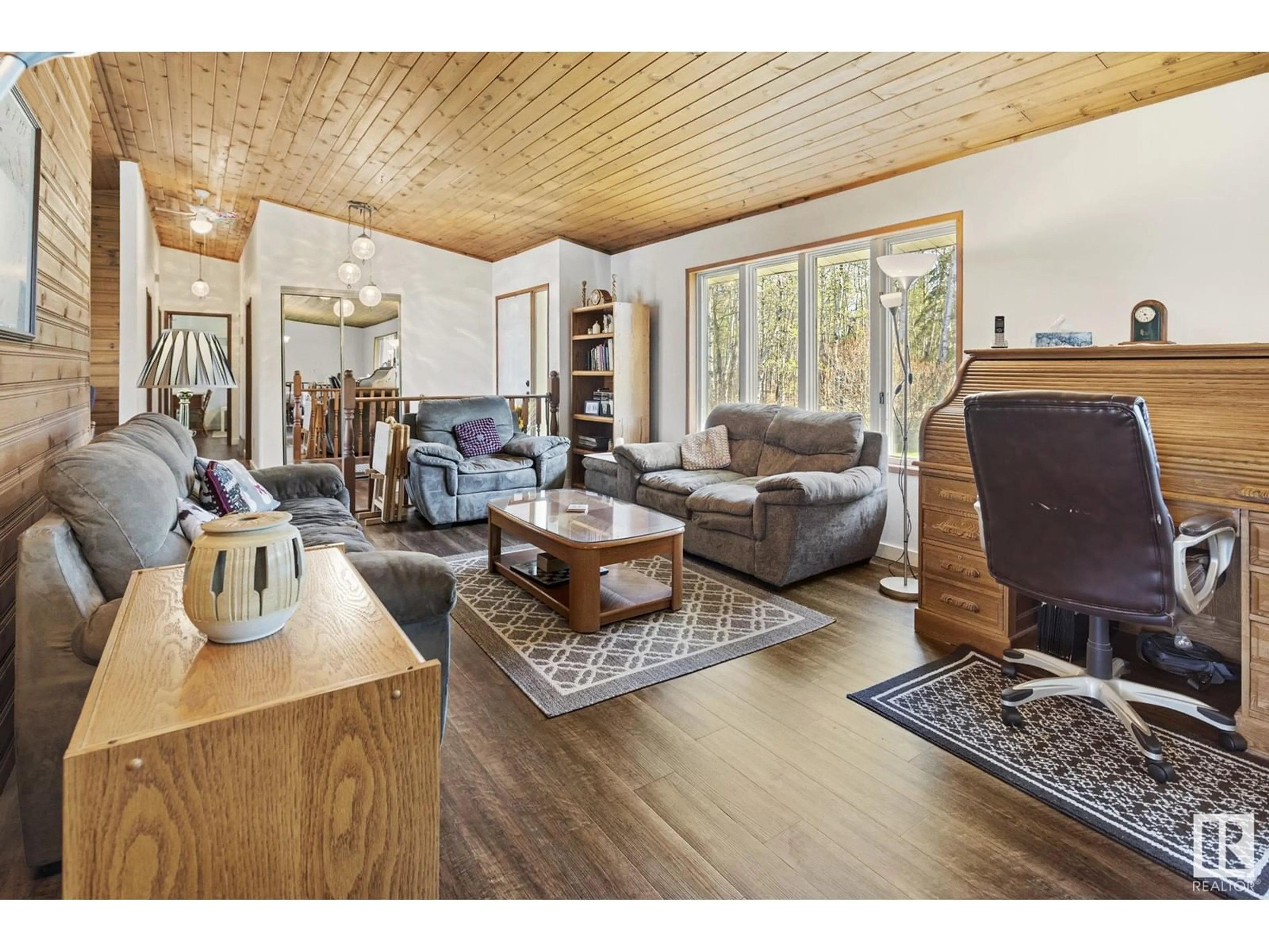 Living room with furniture, wood/laminate floor for 19 - 56420 RGE ROAD 231, Rural Sturgeon County Alberta T0A1N4