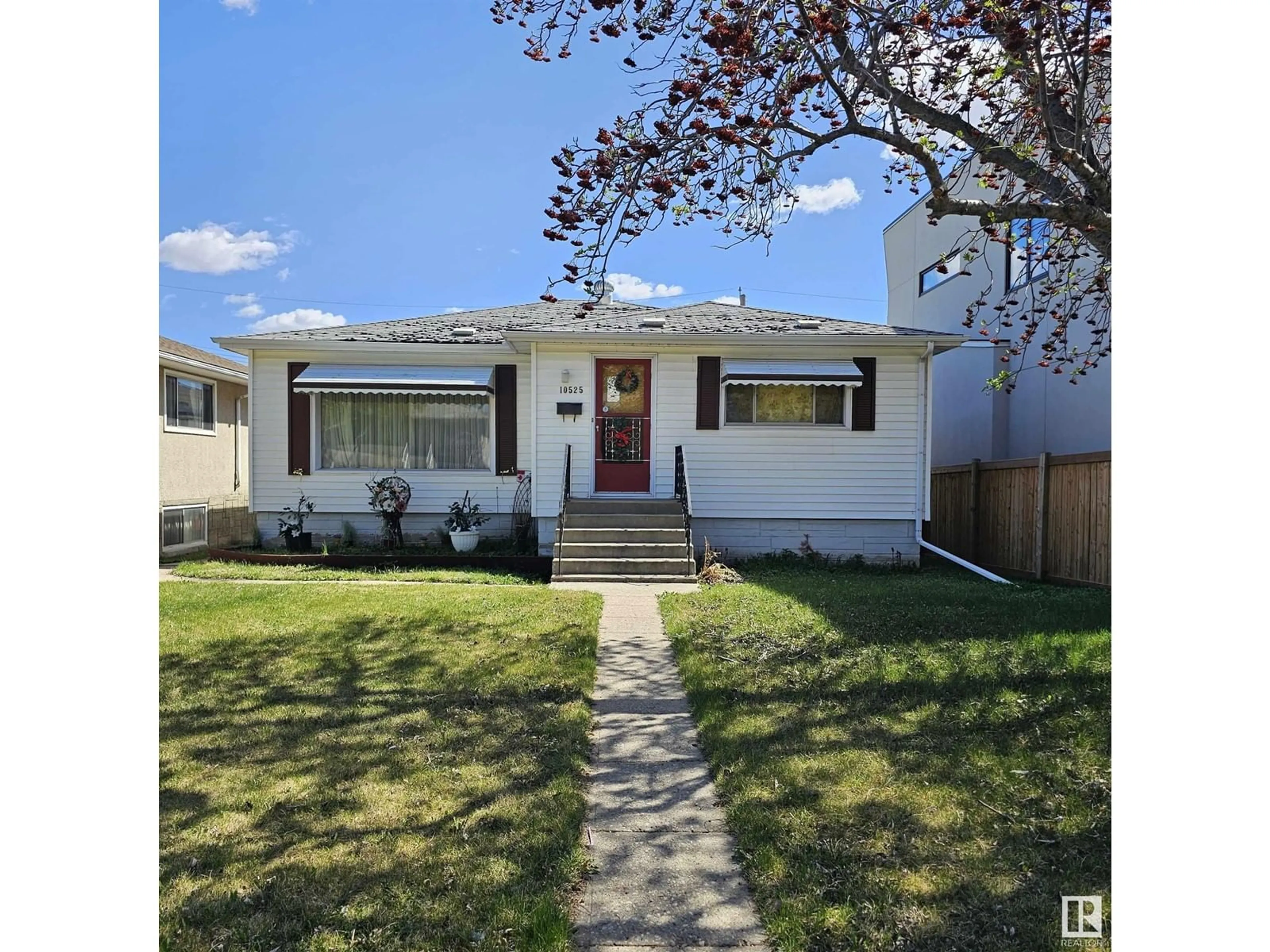 Home with vinyl exterior material, street for 10525 75 ST, Edmonton Alberta T6A2Z6