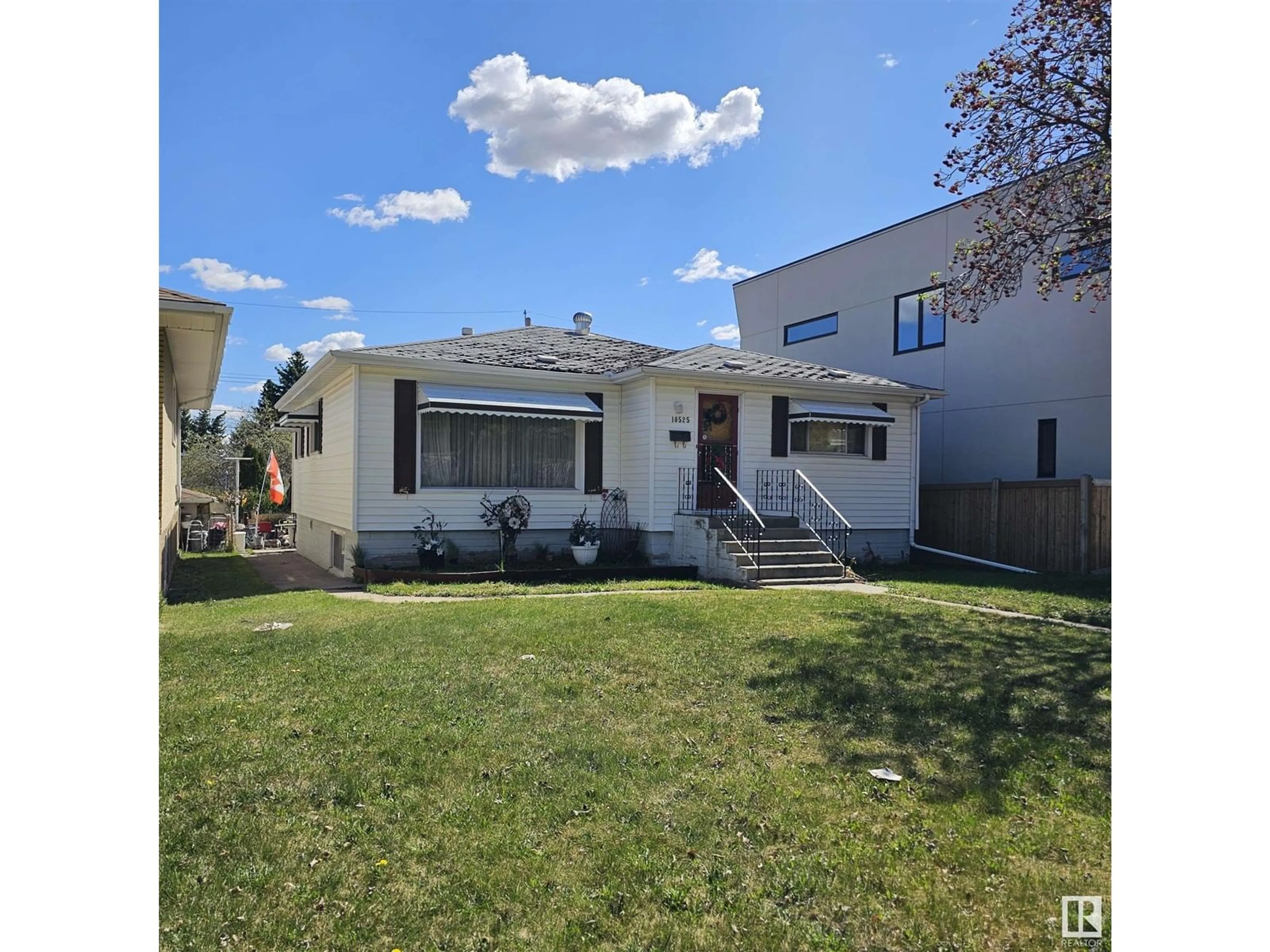 Home with vinyl exterior material, street for 10525 75 ST, Edmonton Alberta T6A2Z6