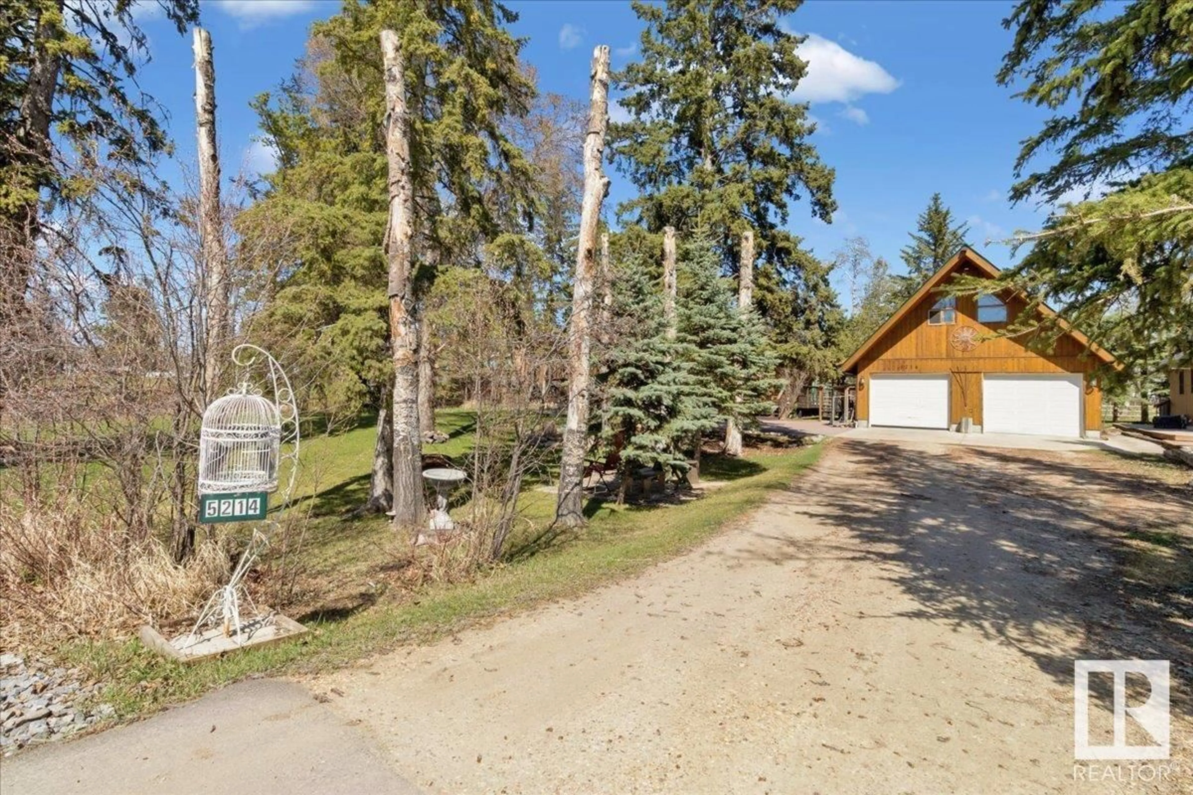 A pic from outside/outdoor area/front of a property/back of a property/a pic from drone, unknown for 5214 LAKE DR, Rural Wetaskiwin County Alberta T0C2C0