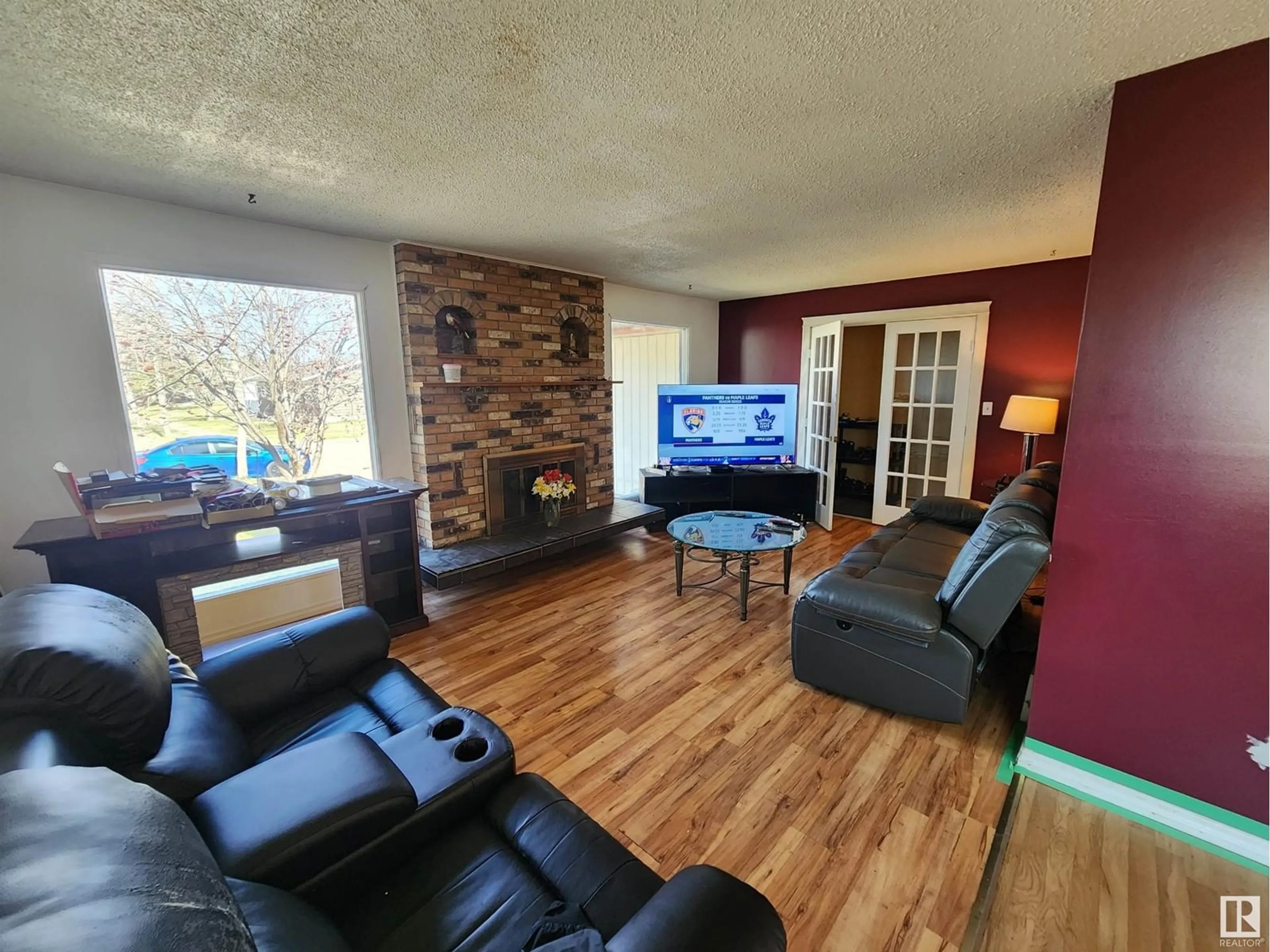 Living room with furniture, wood/laminate floor for 4103 43 ST, Bonnyville Town Alberta T9N1R6